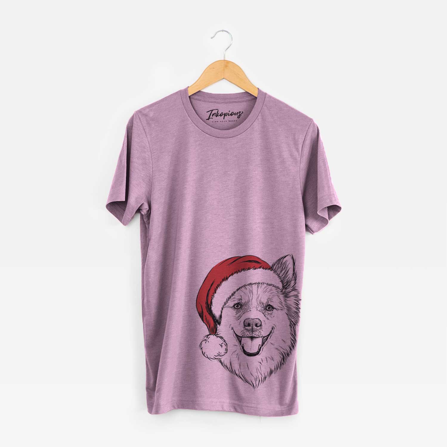 Hand-drawn sketch of Ari the Icelandic Sheepdog wearing a Santa hat on an Orchid Unisex crewneck