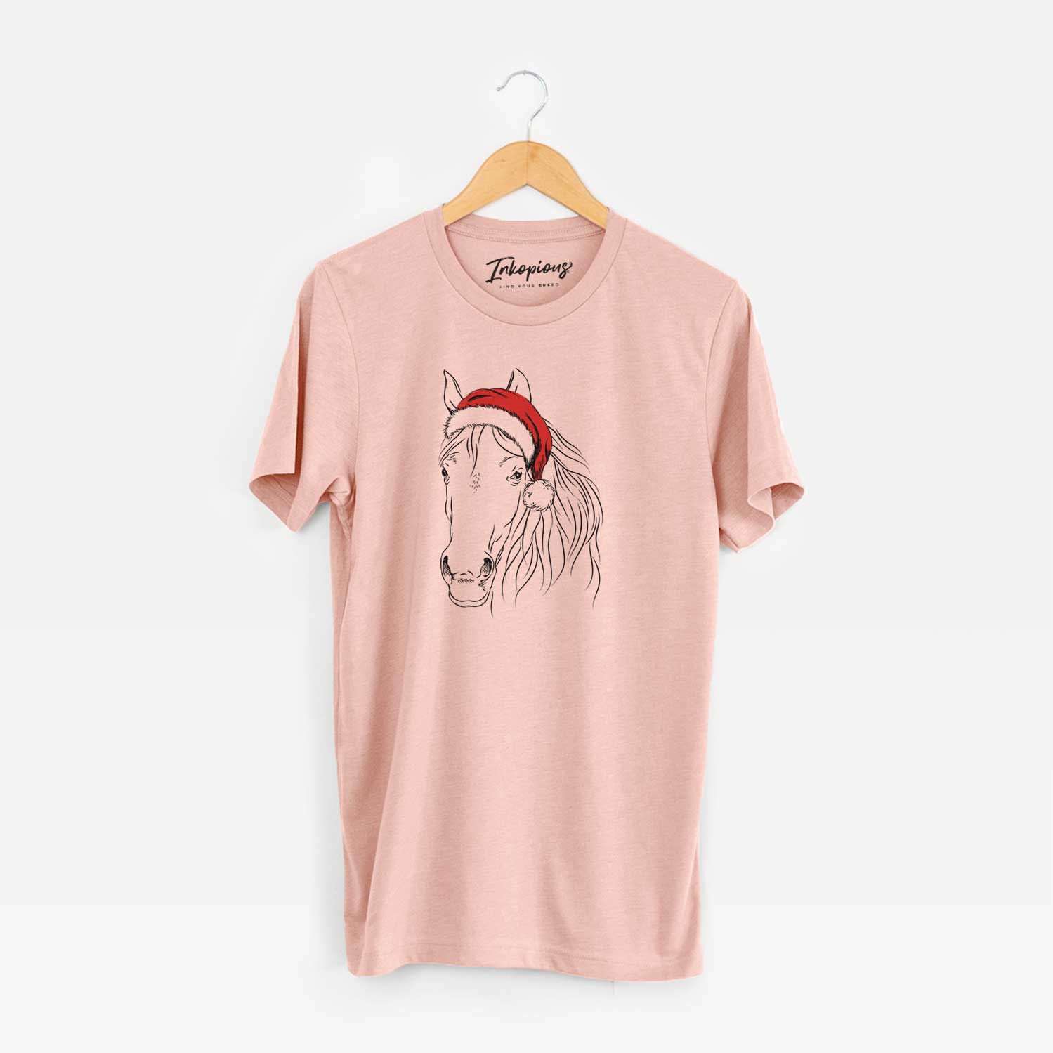Hand-drawn sketch of Aria the Horse wearing a Santa hat on a Peach Unisex crewneck