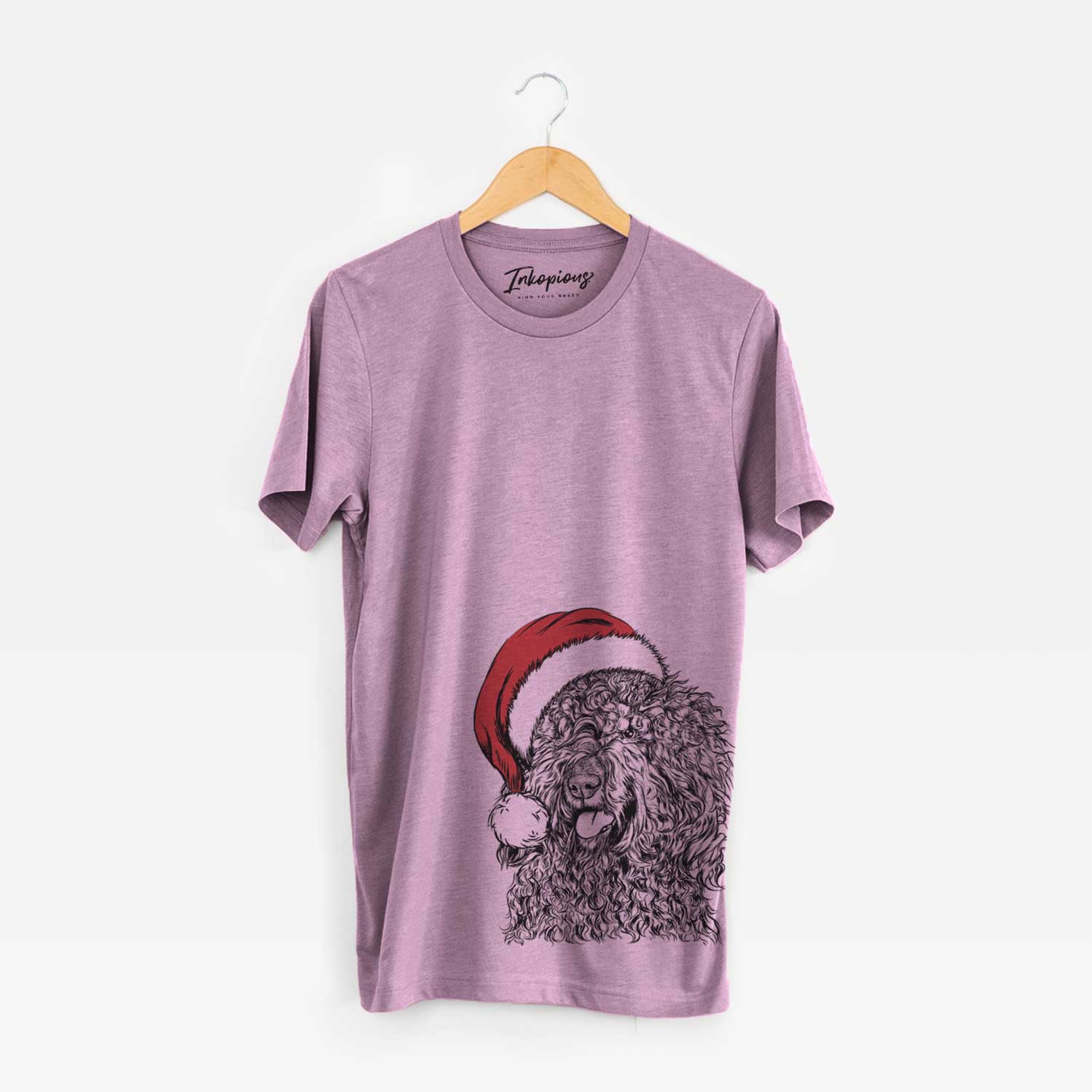 Hand-drawn sketch of Babs the Barbet wearing a Santa hat on an Orchid Unisex crewneck
