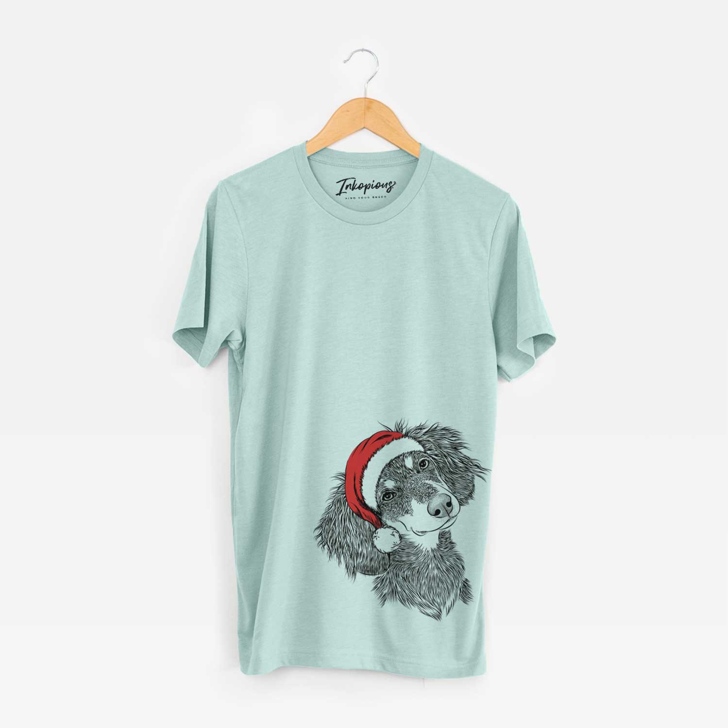 Hand-drawn sketch of Bailey the Long Haired Dachshund wearing a Santa hat on a Heather Sage Unisex crewneck