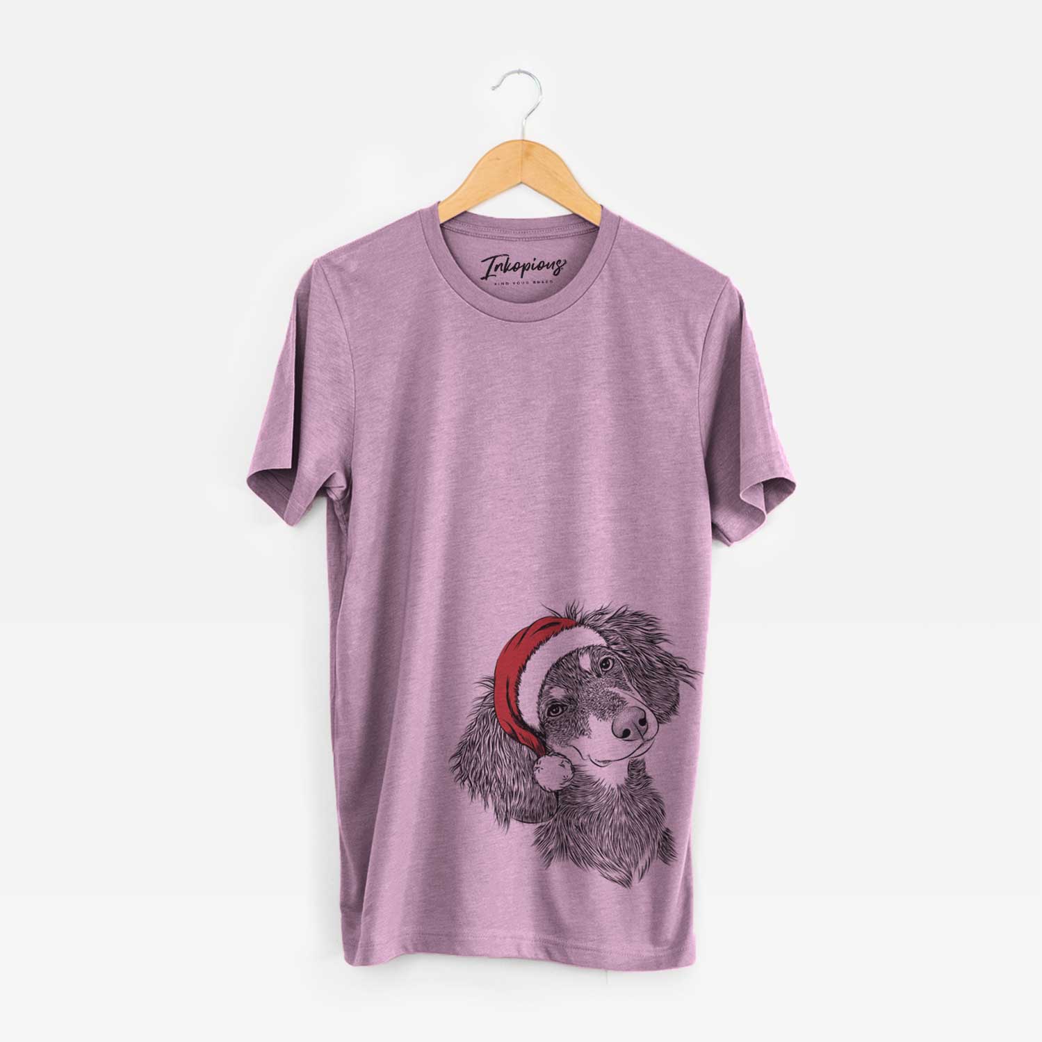 Hand-drawn sketch of Bailey the Long Haired Dachshund wearing a Santa hat on an Orchid Unisex crewneck