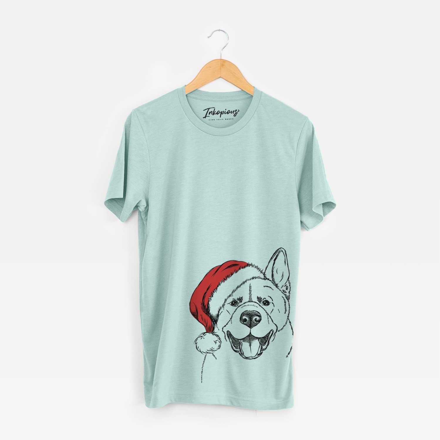 Hand-drawn sketch of Baku the Akita wearing a Santa hat on a Heather Sage Unisex crewneck