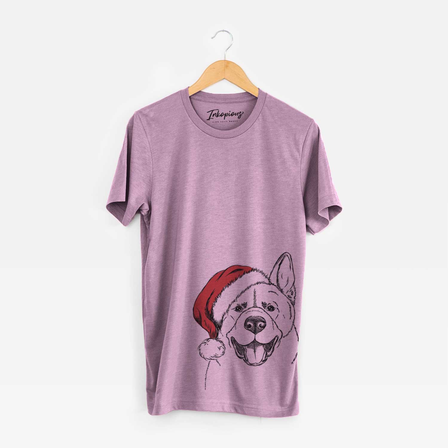 Hand-drawn sketch of Baku the Akita wearing a Santa hat on an Orchid Unisex crewneck