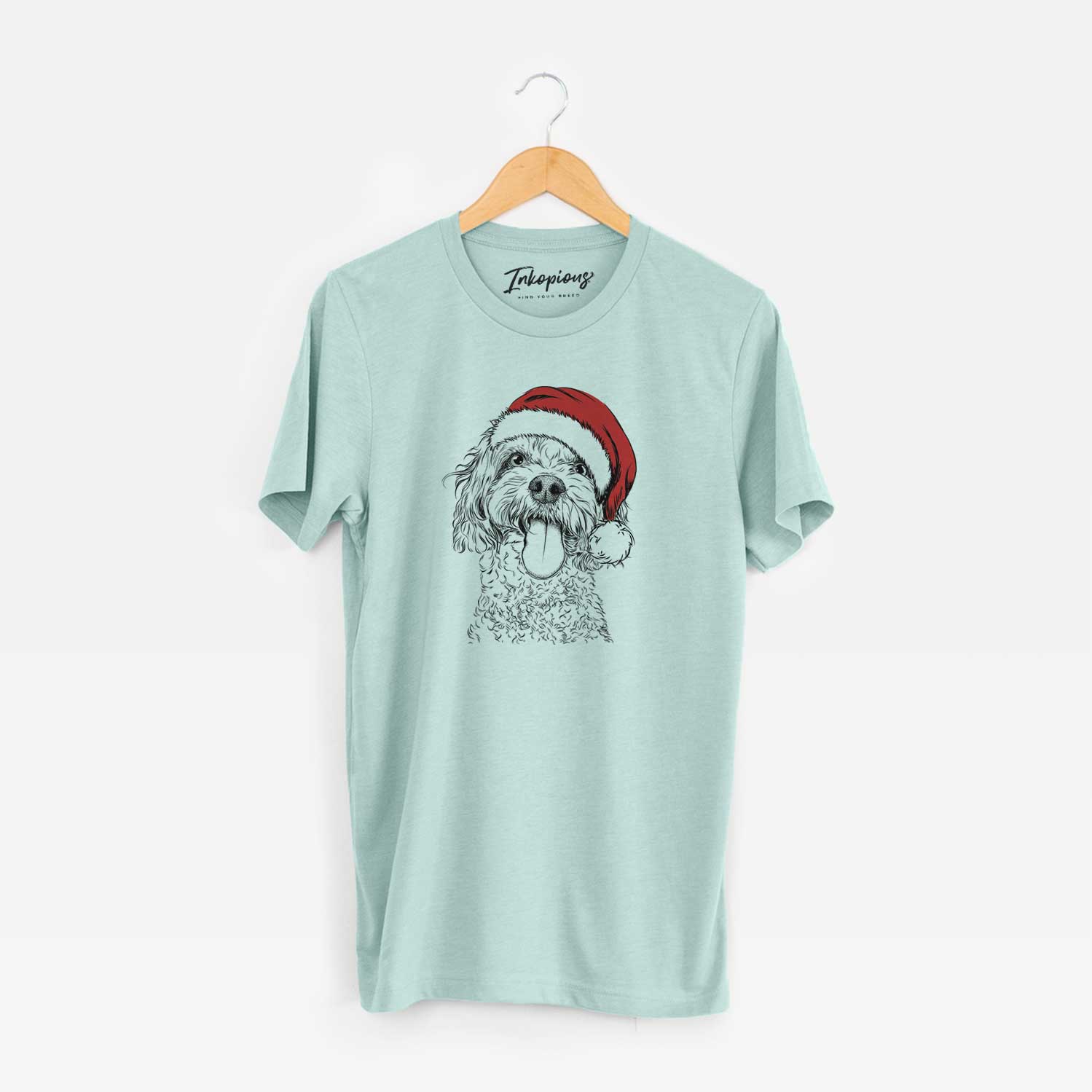 Hand-drawn sketch of Barney the Cavachon wearing a Santa hat on a Heather Sage Unisex crewneck