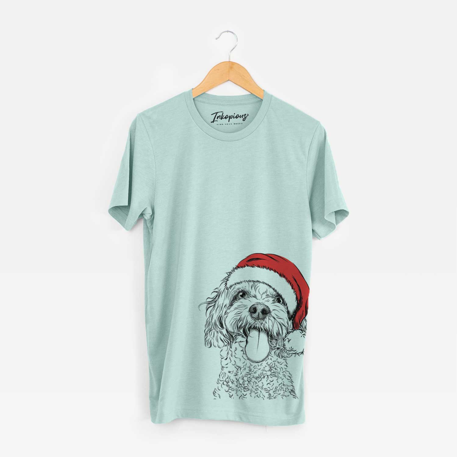 Hand-drawn sketch of Barney the Cavachon wearing a Santa hat on a Heather Sage Unisex crewneck