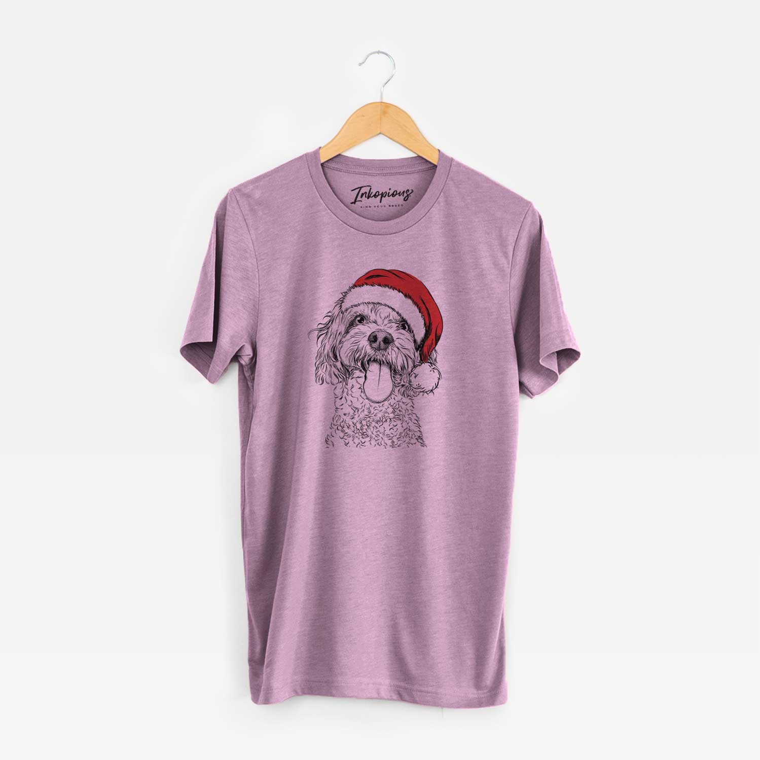 Hand-drawn sketch of Barney the Cavachon wearing a Santa hat on an Orchid Unisex crewneck