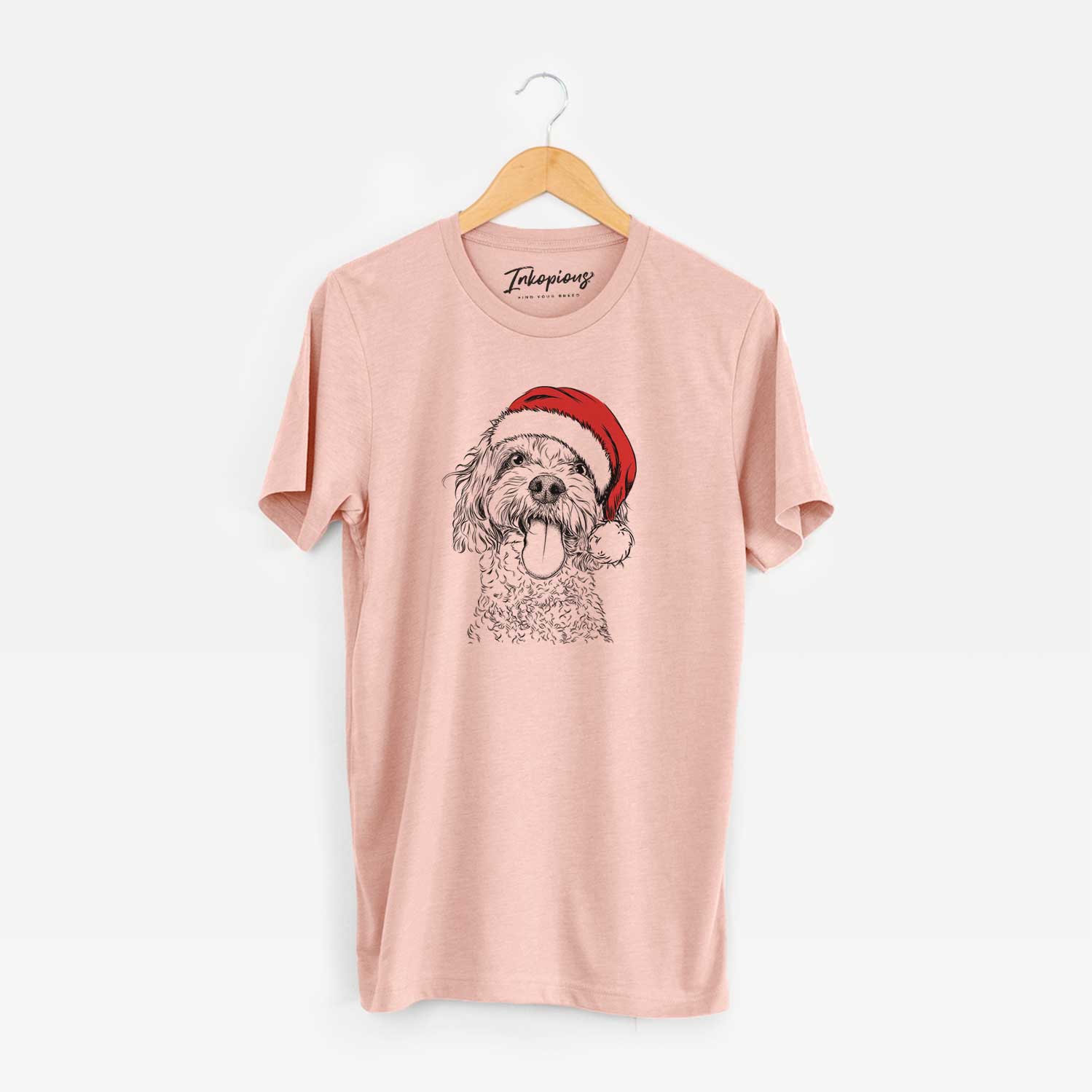 Hand-drawn sketch of Barney the Cavachon wearing a Santa hat on a Peach Unisex crewneck