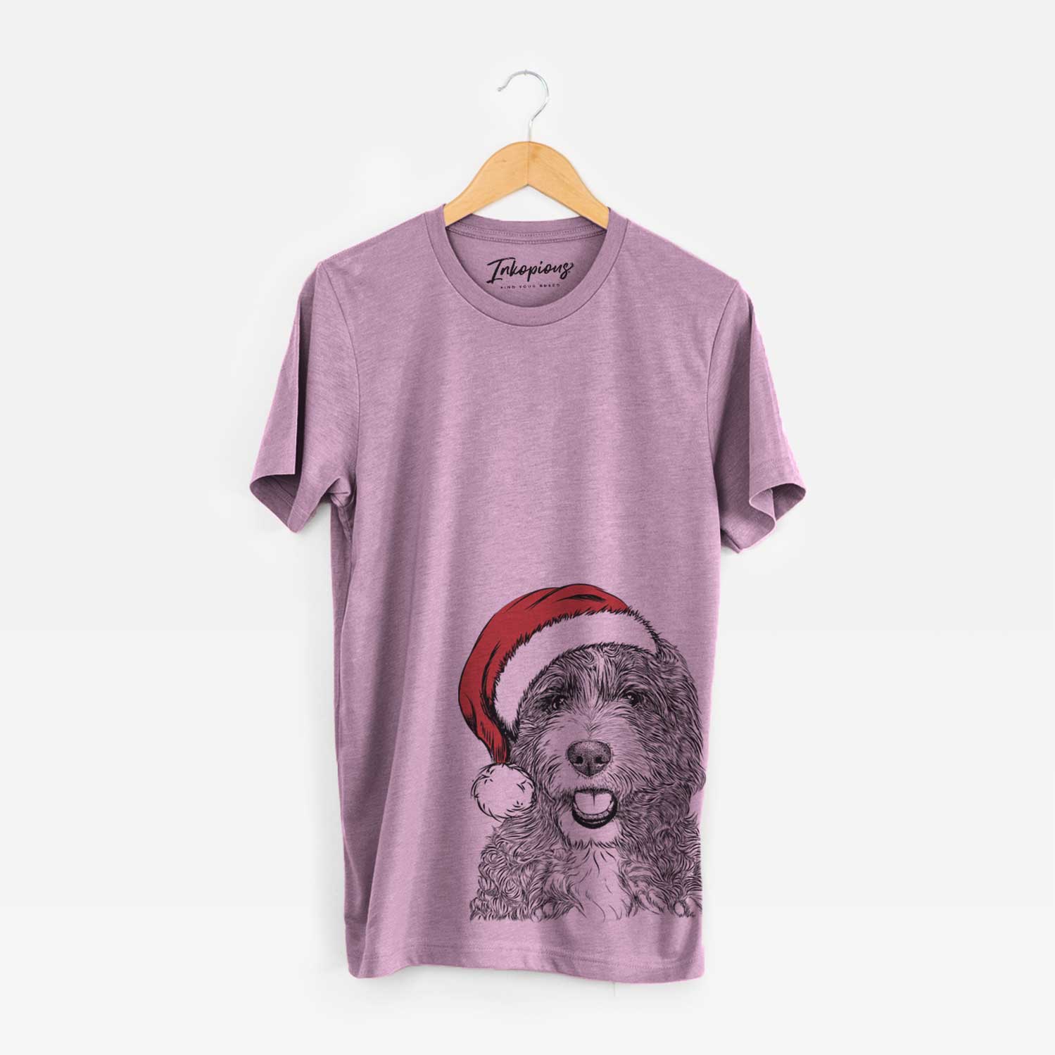 Hand-drawn sketch of Bash the Bernedoodle wearing a Santa hat on an Orchid Unisex crewneck