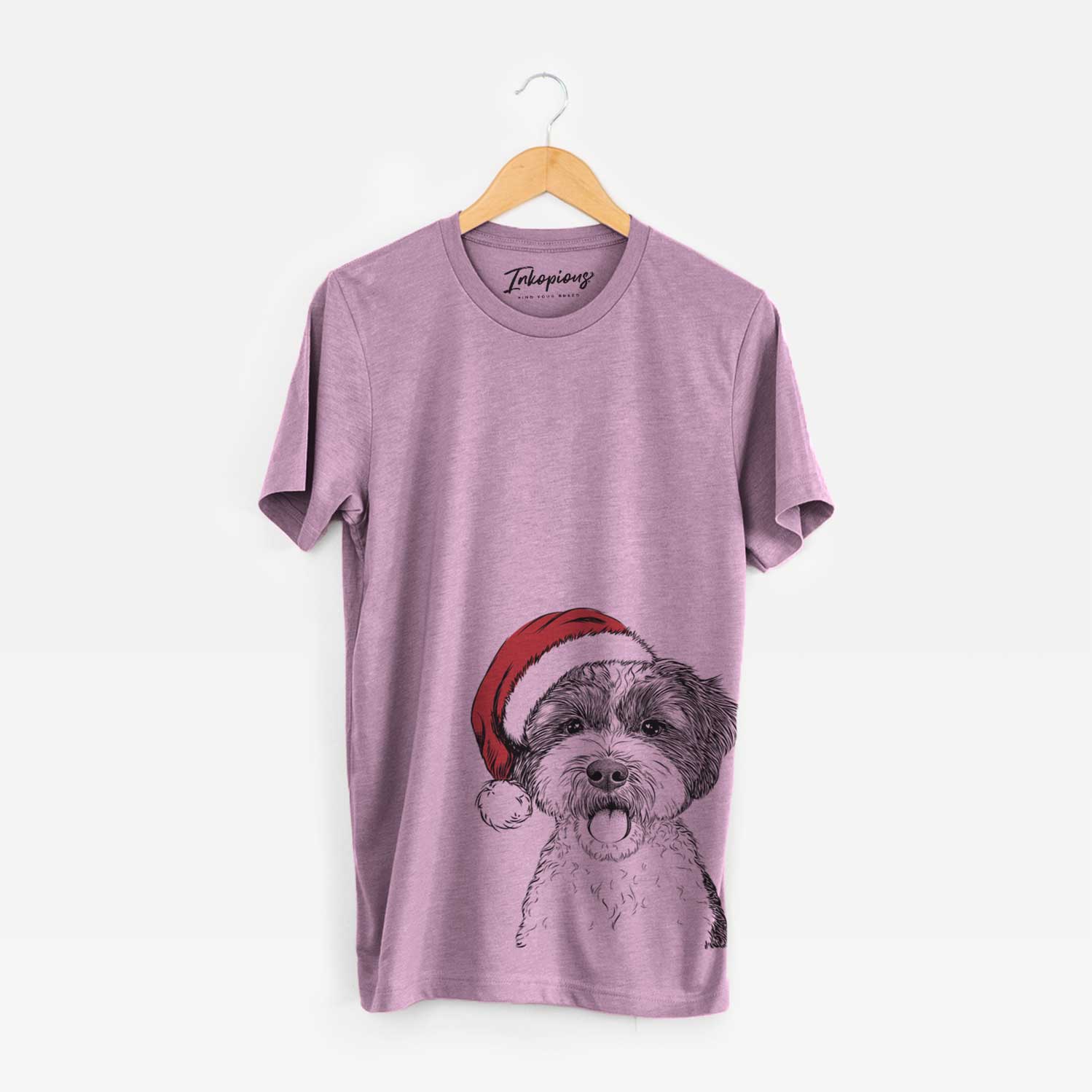 Hand-drawn sketch of Bella the Cockapoo wearing a Santa hat on an Orchid Unisex crewneck