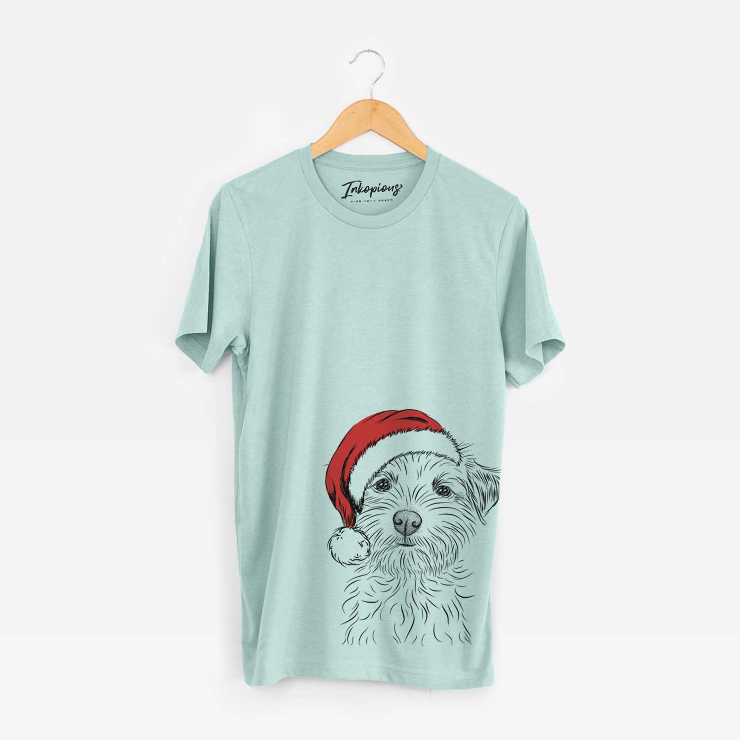 Hand-drawn sketch of Benjamin the Border Terrier wearing a Santa hat on a Heather Sage Unisex crewneck