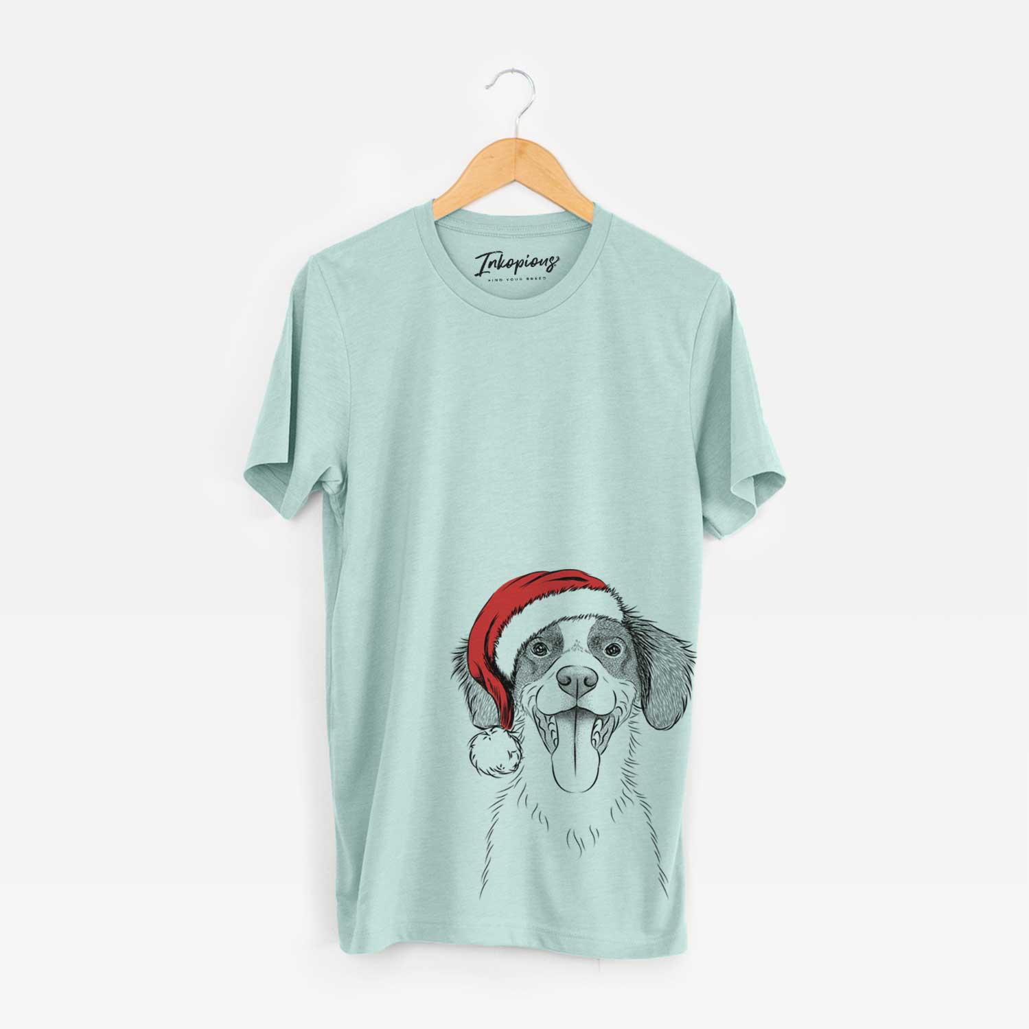 Hand-drawn sketch of Birdie the Brittany wearing a Santa hat on a Heather Sage Unisex crewneck