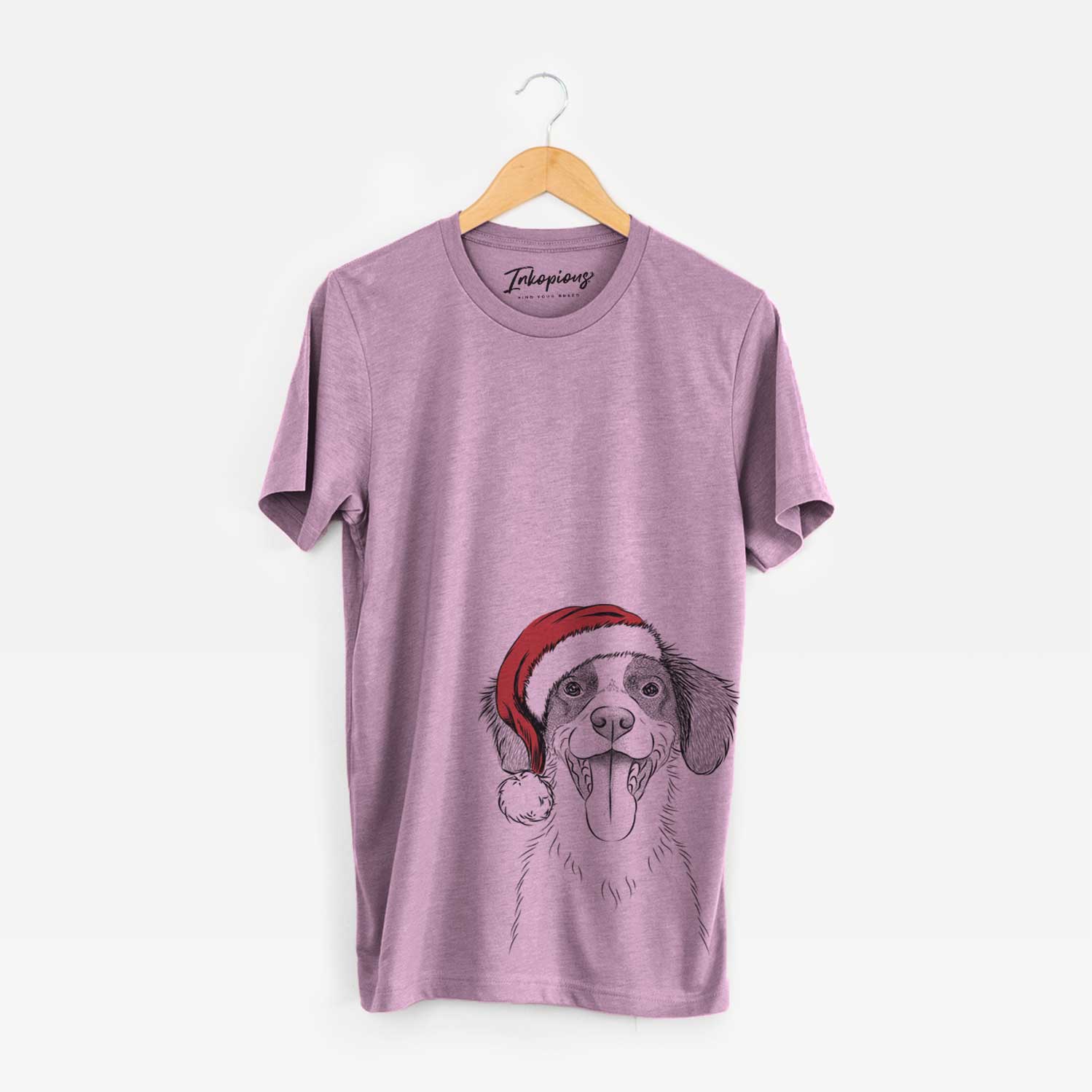 Hand-drawn sketch of Birdie the Brittany wearing a Santa hat on an Orchid Unisex crewneck