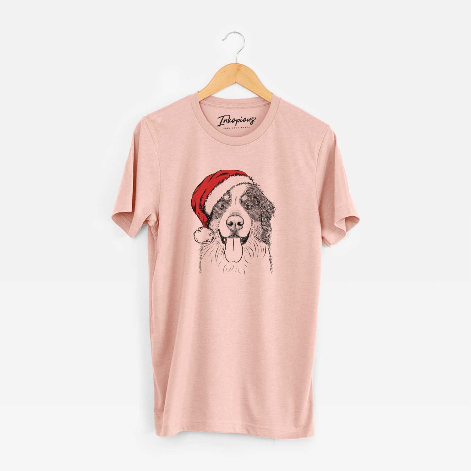 Hand-drawn sketch of Blaze the Bernese Mountain Dog wearing a Santa hat on a Peach Unisex crewneck