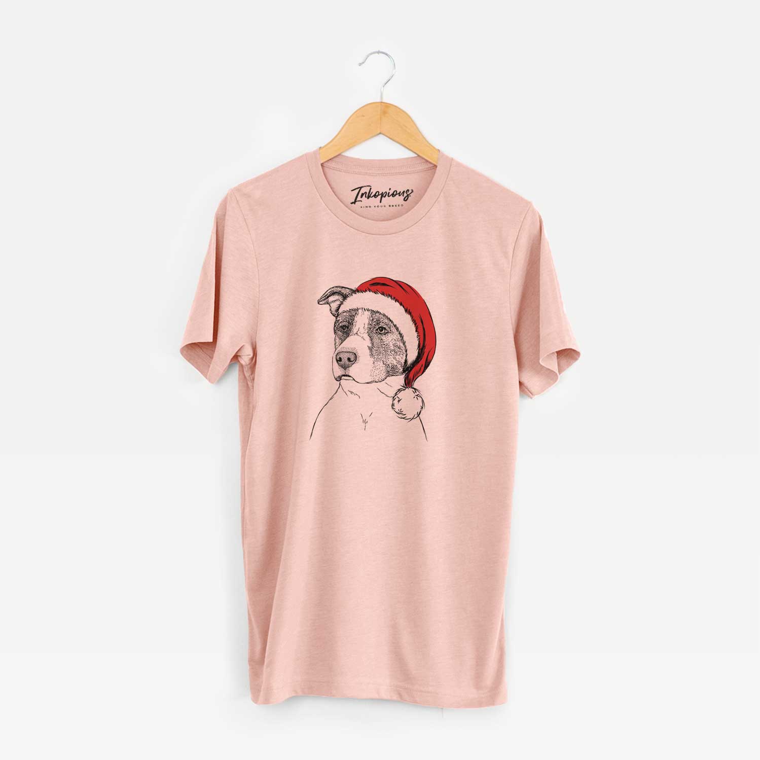 Hand-drawn sketch of Blu the Pitbull wearing a Santa hat on a Peach Unisex crewneck