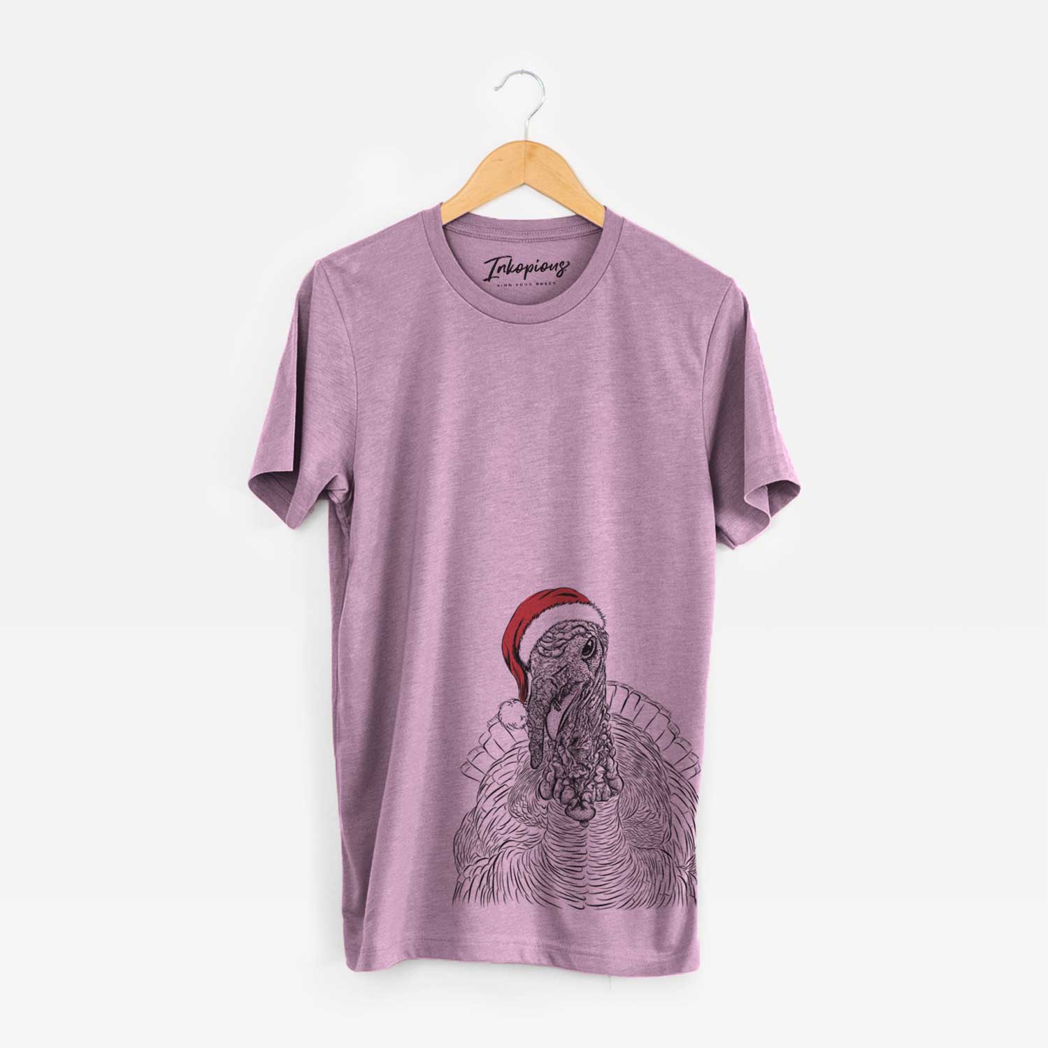 Hand-drawn sketch of Brady the Turkey wearing a Santa hat on an Orchid Unisex crewneck
