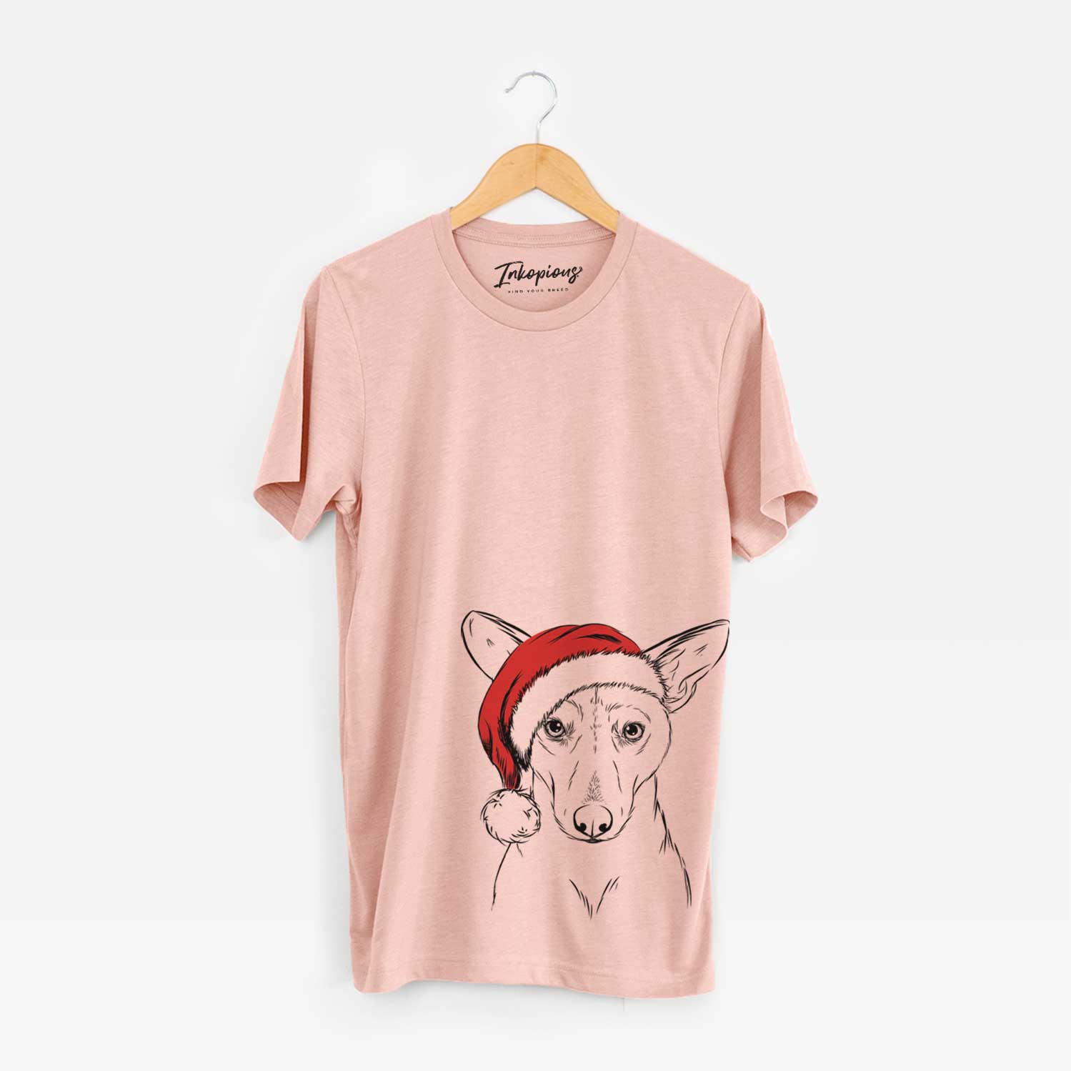 Hand-drawn sketch of Buff the Dorgi wearing a Santa hat on a Peach Unisex crewneck