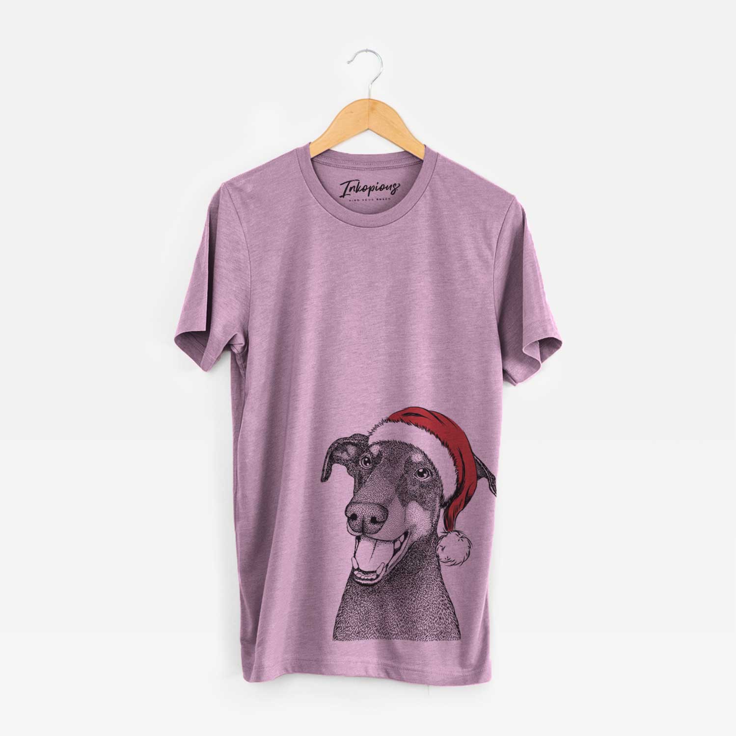 Hand-drawn sketch of Bunnie the Doberman Pinscher wearing a Santa hat on an Orchid Unisex crewneck
