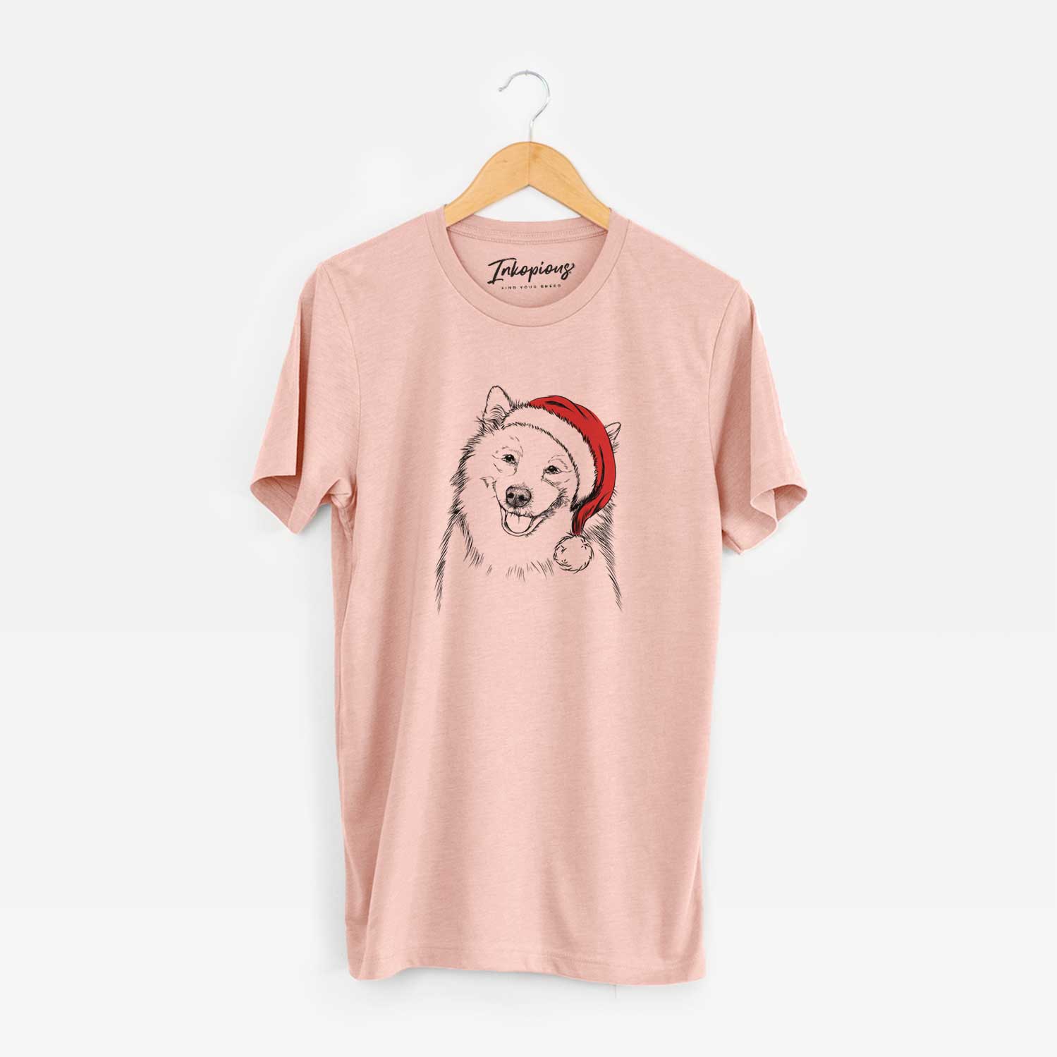 Hand-drawn sketch of Caico the Samoyed wearing a Santa hat on a Peach Unisex crewneck