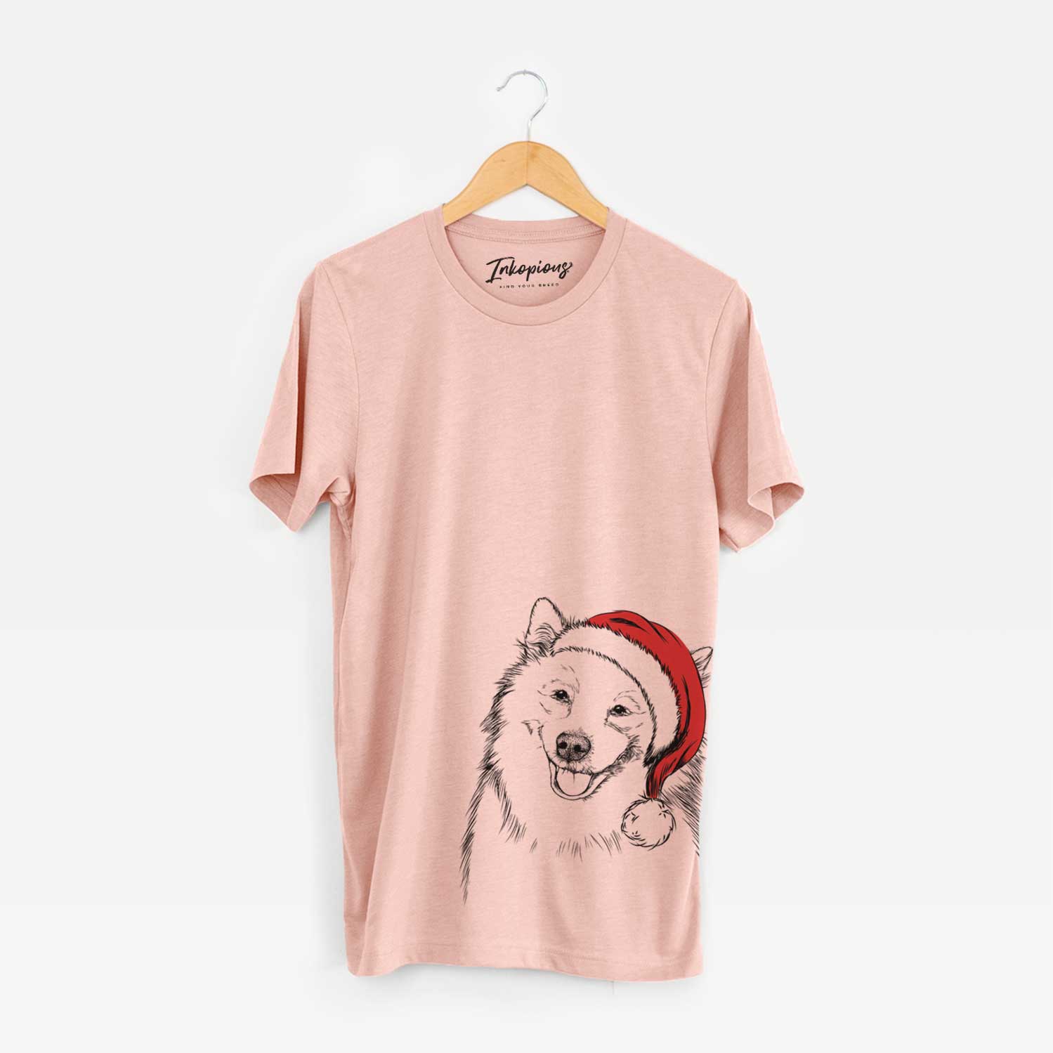 Hand-drawn sketch of Caico the Samoyed wearing a Santa hat on a Peach Unisex crewneck