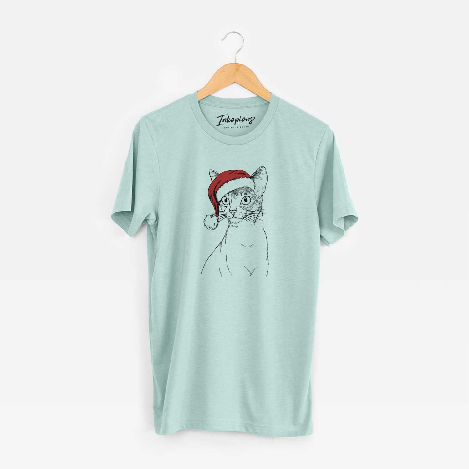 Hand-drawn sketch of Cedric the Abyssinian Cat wearing a Santa hat on a Heather Sage Unisex crewneck