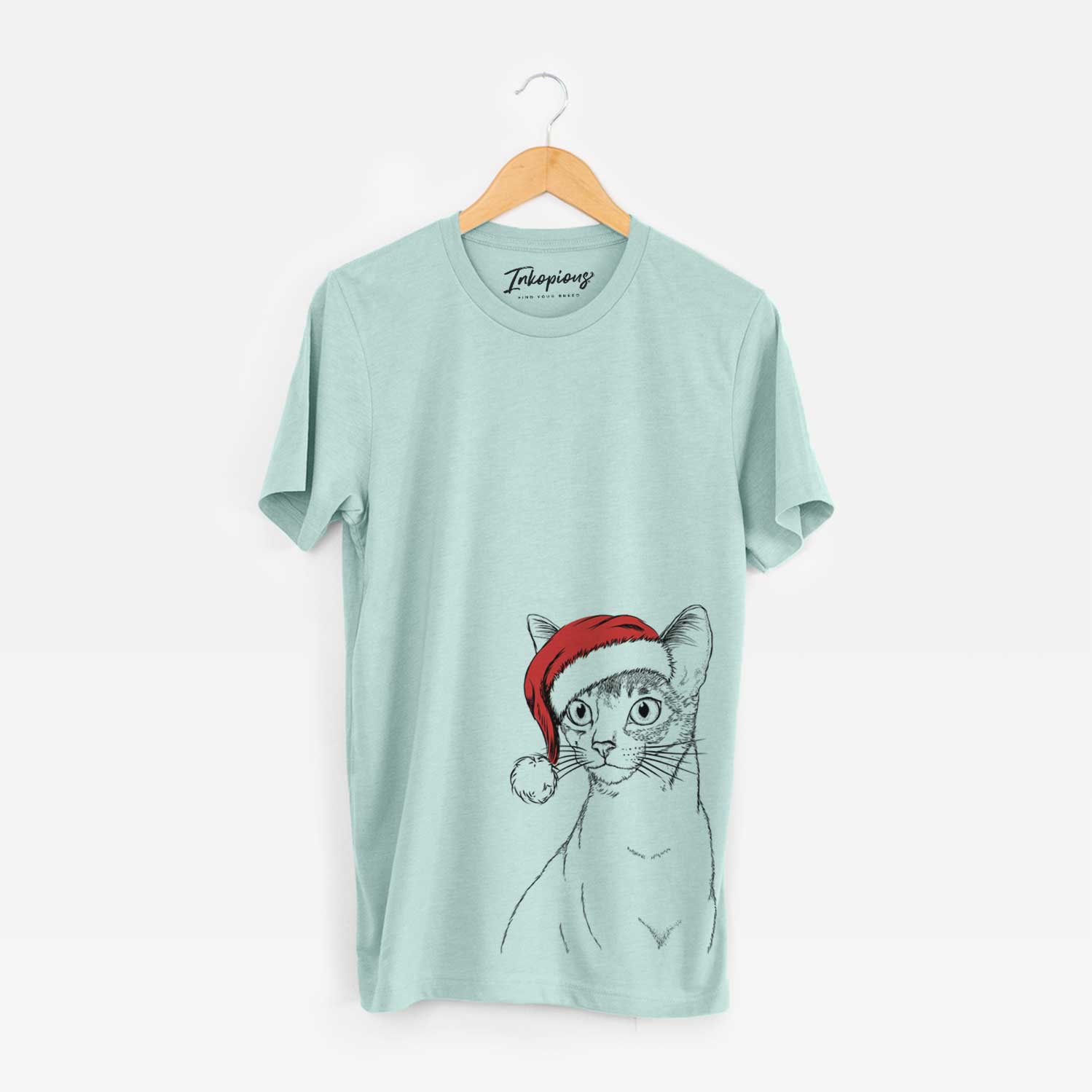 Hand-drawn sketch of Cedric the Abyssinian Cat wearing a Santa hat on a Heather Sage Unisex crewneck