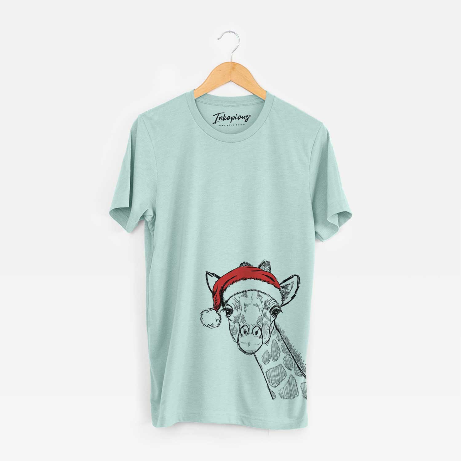 Hand-drawn sketch of Cedrick the Giraffe wearing a Santa hat on a Heather Sage Unisex crewneck