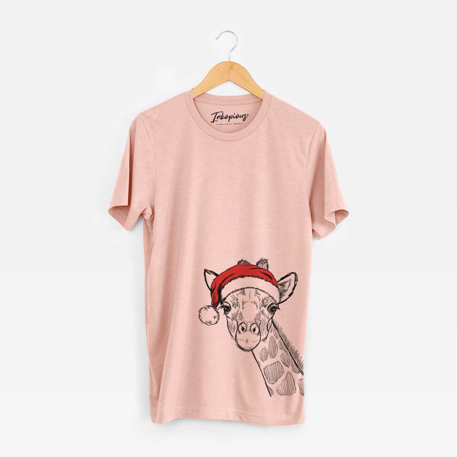 Hand-drawn sketch of Cedrick the Giraffe wearing a Santa hat on a Peach Unisex crewneck