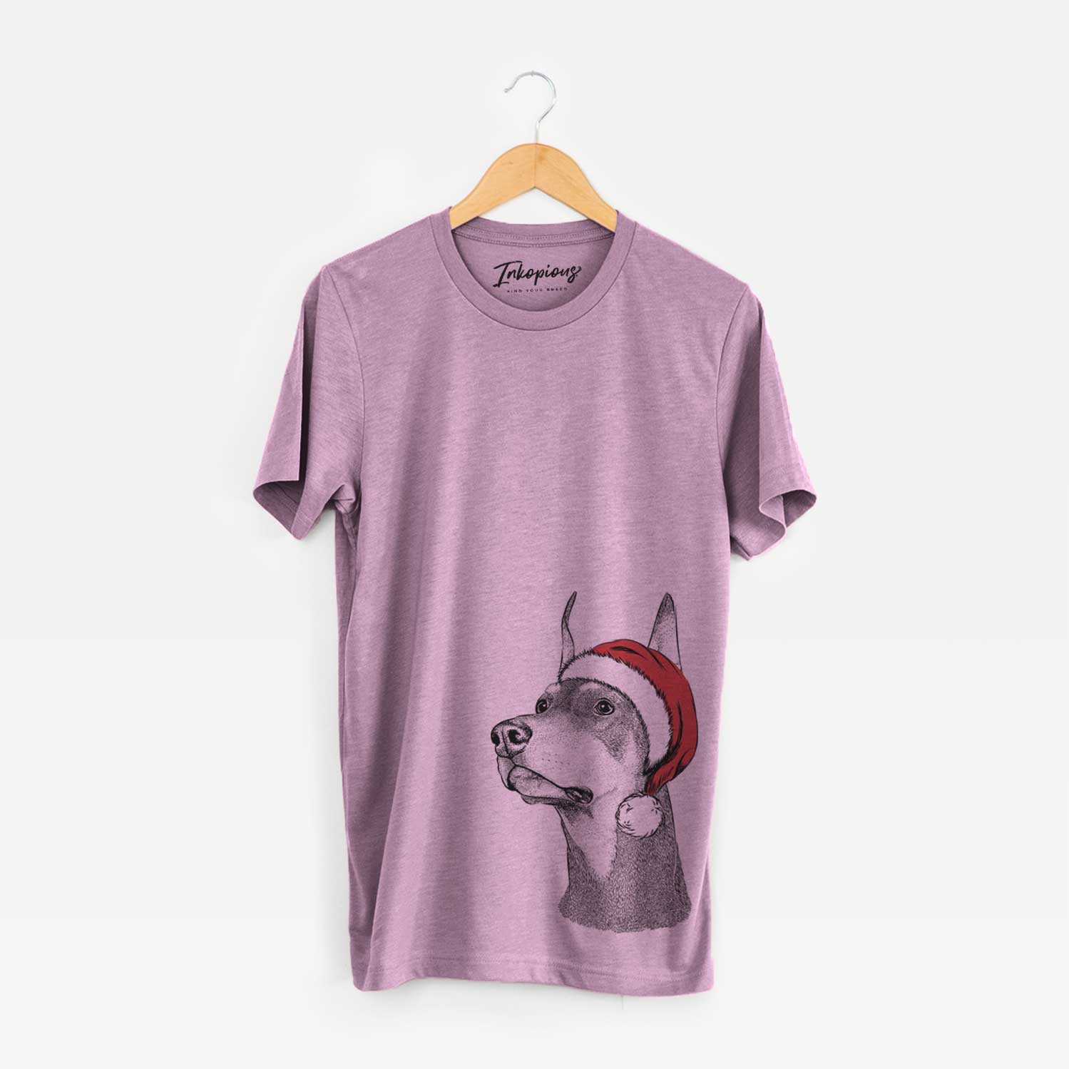 Hand-drawn sketch of Cenza the Doberman Pinscher wearing a Santa hat on an Orchid Unisex crewneck