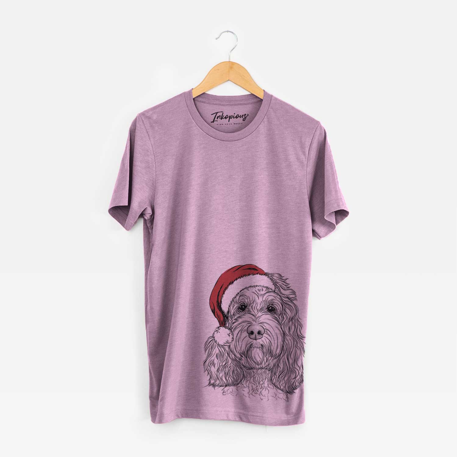 Hand-drawn sketch of Chloe the Cockapoo wearing a Santa hat on an Orchid Unisex crewneck