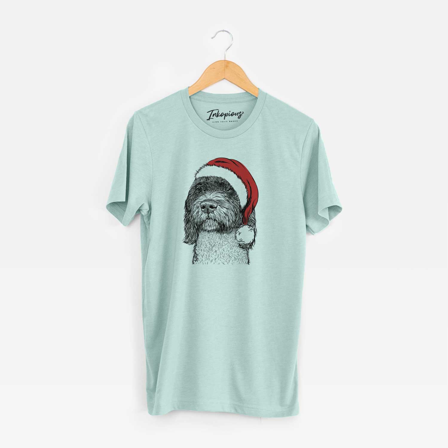 Hand-drawn sketch of Chris the Portuguese Water Dog wearing a Santa hat on a Heather Sage Unisex crewneck