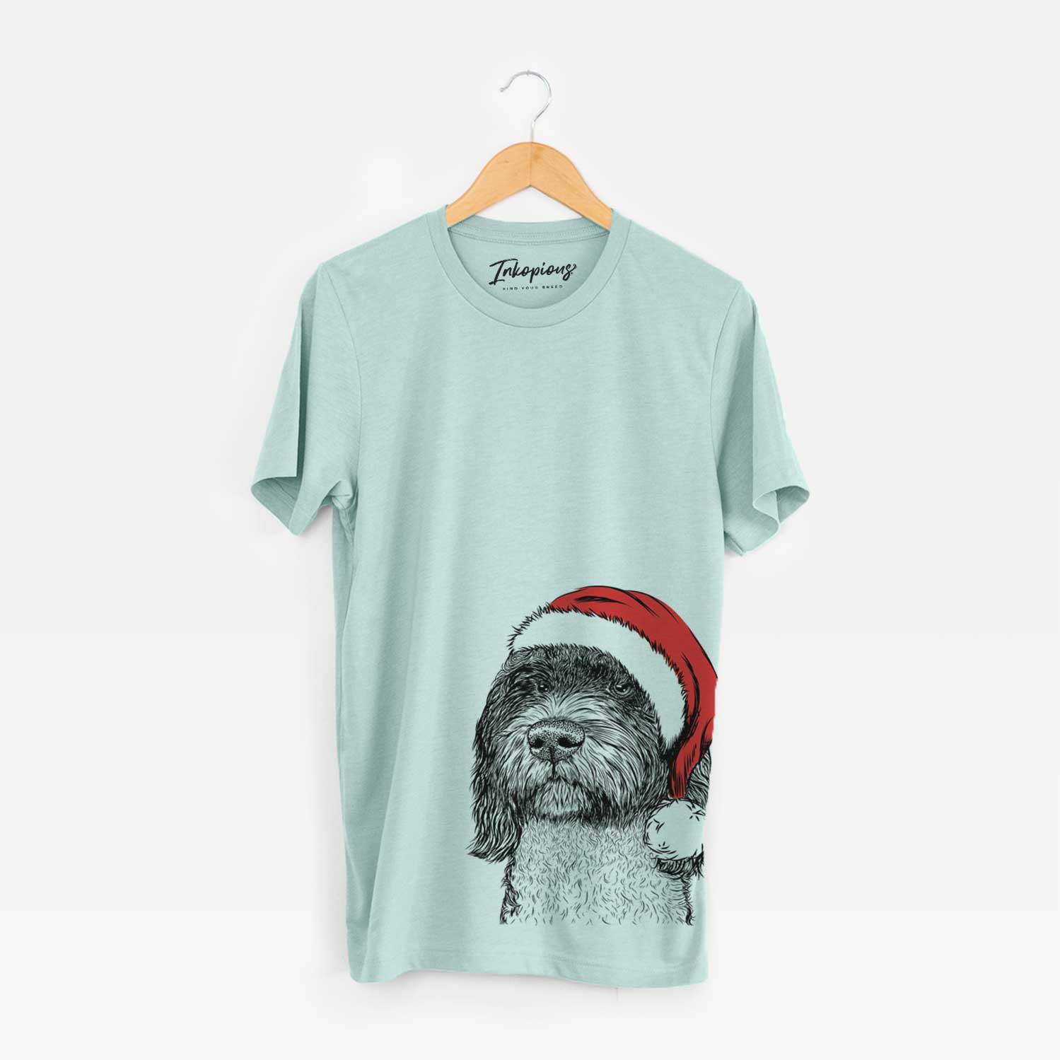 Hand-drawn sketch of Chris the Portuguese Water Dog wearing a Santa hat on a Heather Sage Unisex crewneck