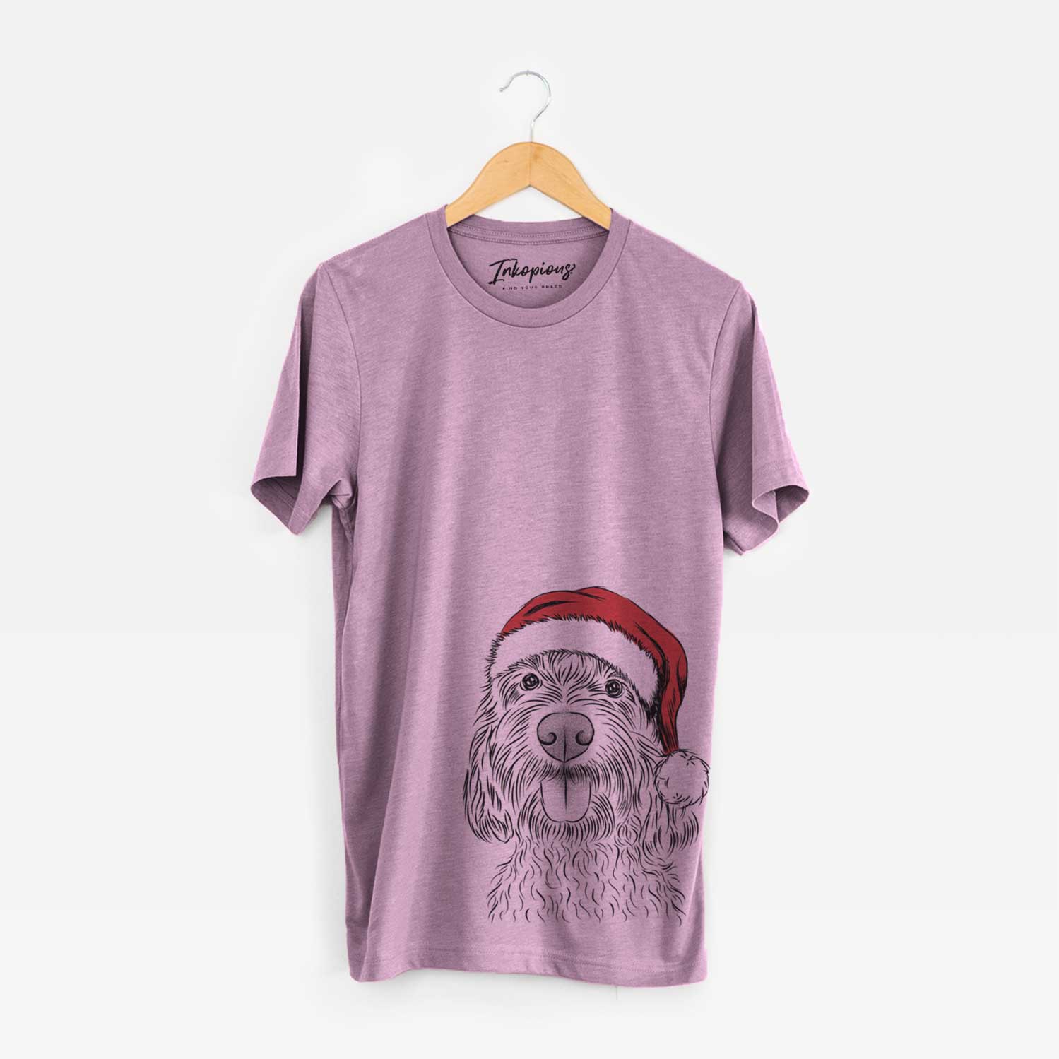 Hand-drawn sketch of Clover the Cockapoo wearing a Santa hat on an Orchid Unisex crewneck
