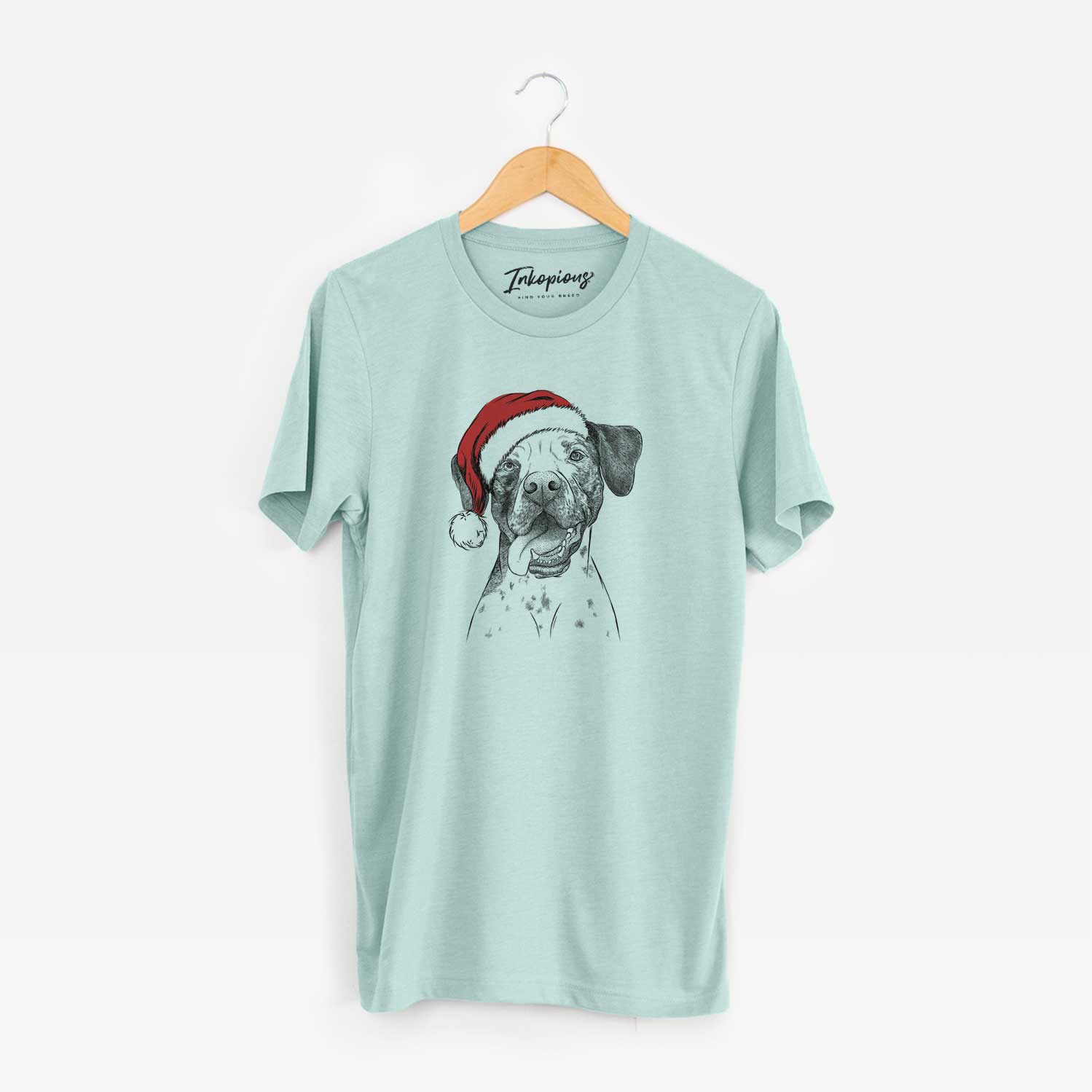 Hand-drawn sketch of Cola the Catahoula wearing a Santa hat on a Heather Sage Unisex crewneck