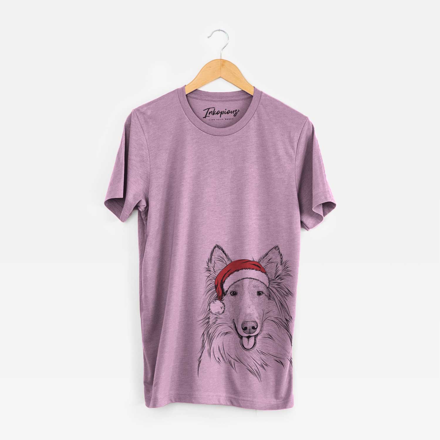 Hand-drawn sketch of Conrad the Rough Collie wearing a Santa hat on an Orchid Unisex crewneck