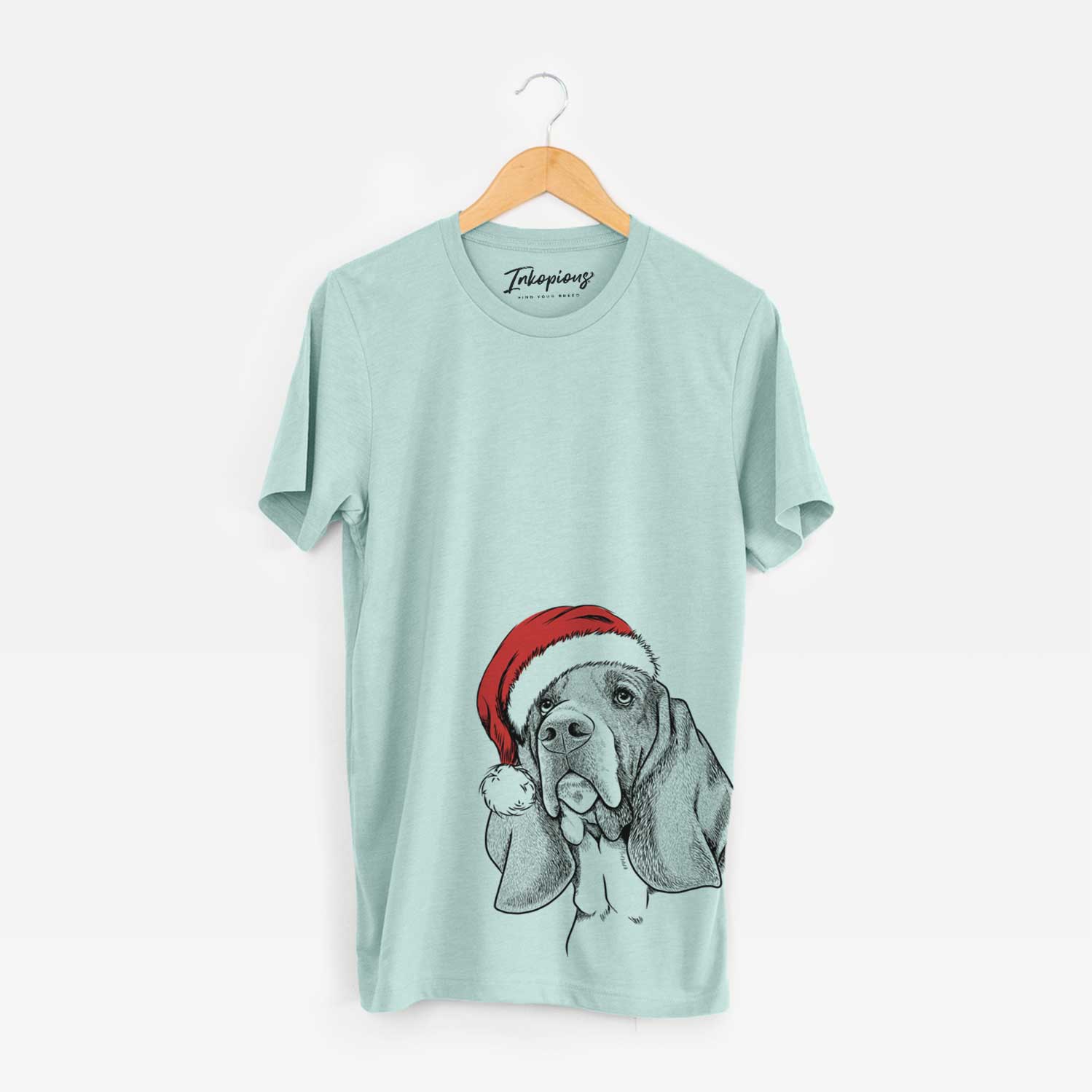 Hand-drawn sketch of Cooper the Basset Hound wearing a Santa hat on a Heather Sage Unisex crewneck