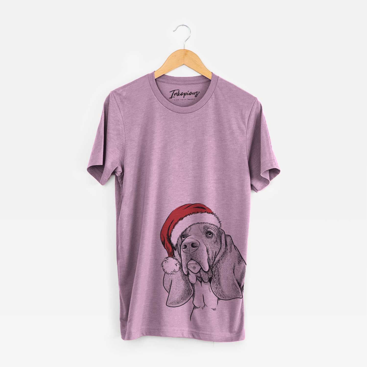 Hand-drawn sketch of Cooper the Basset Hound wearing a Santa hat on an Orchid Unisex crewneck