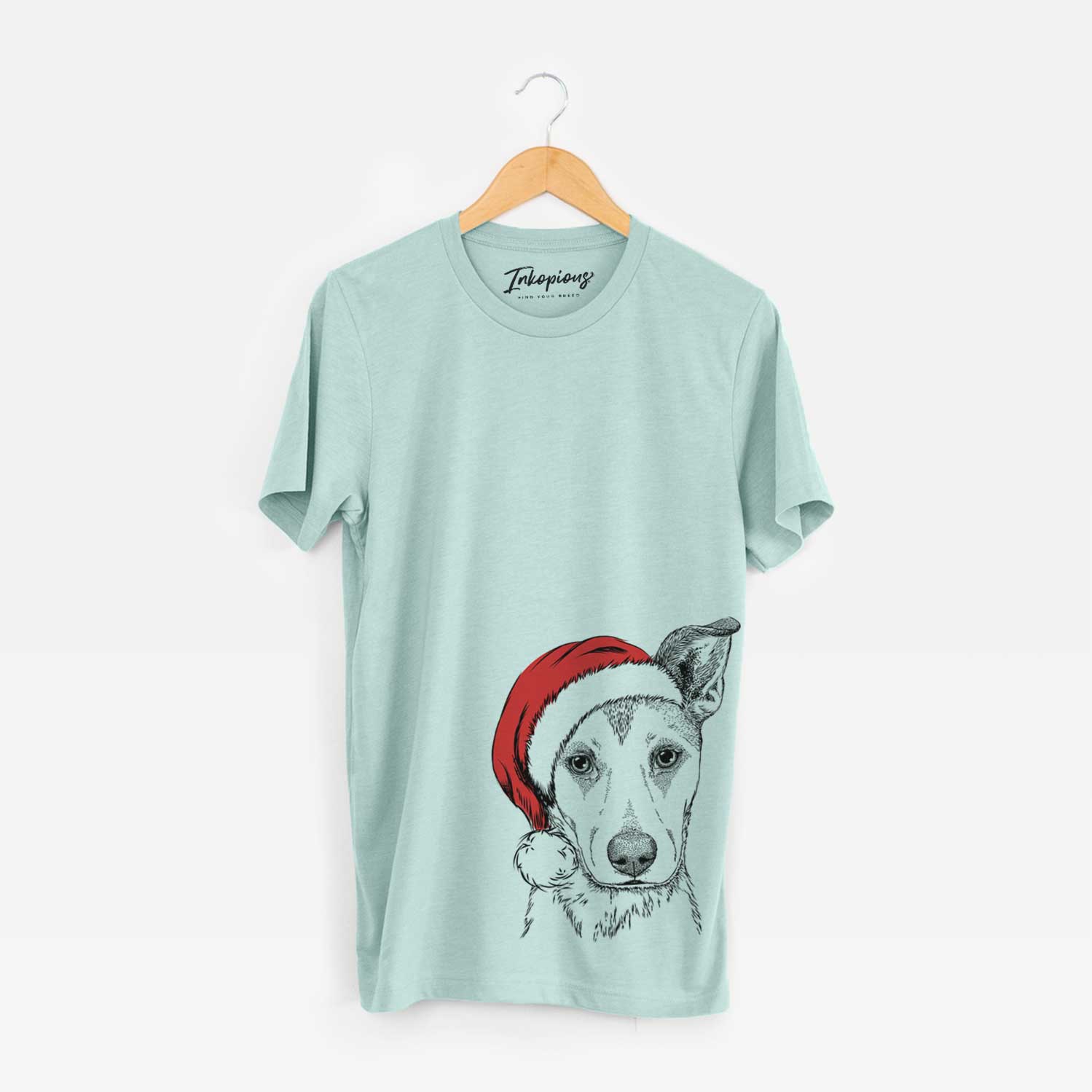 Hand-drawn sketch of Coral the Mixed Breed wearing a Santa hat on a Heather Sage Unisex crewneck