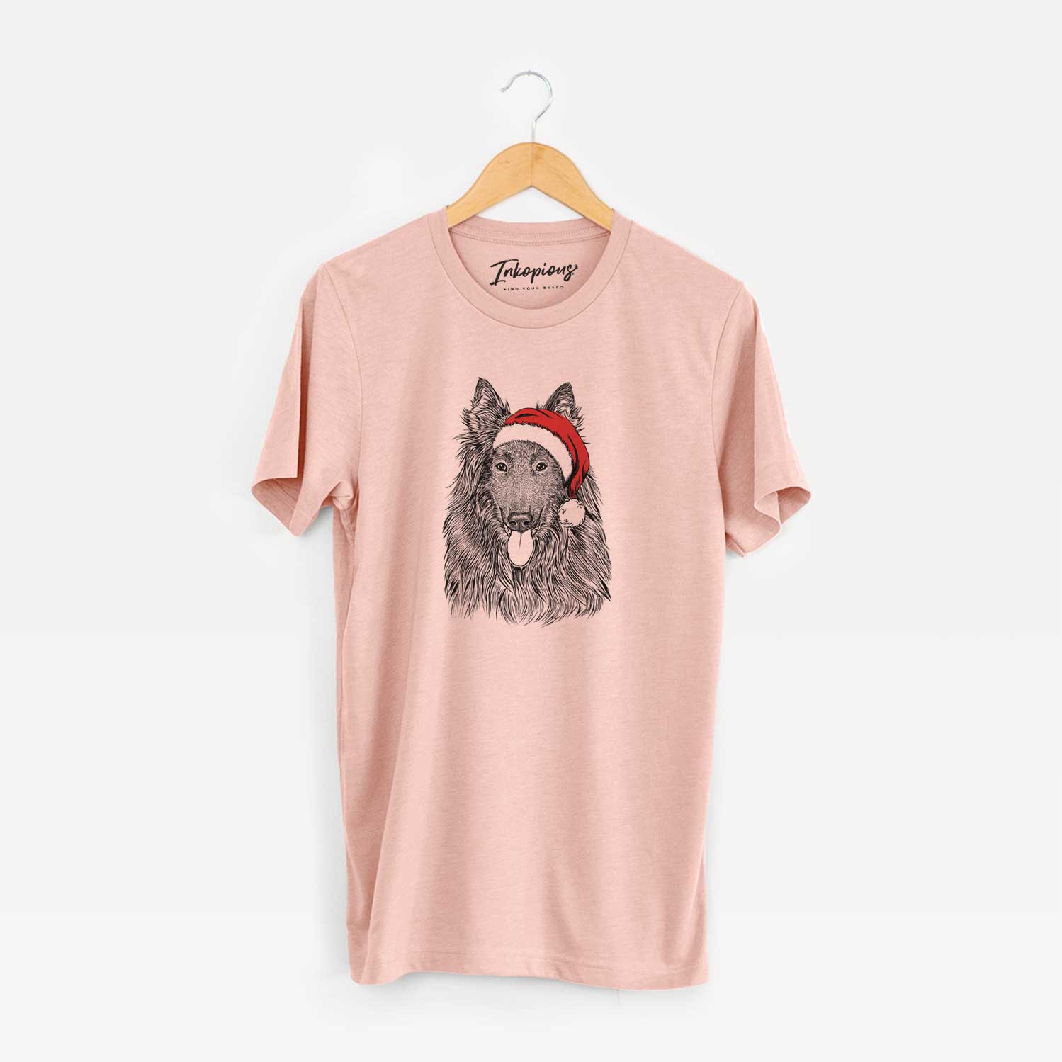 Hand-drawn sketch of Daan the Belgian Shepherd wearing a Santa hat on a Peach Unisex crewneck