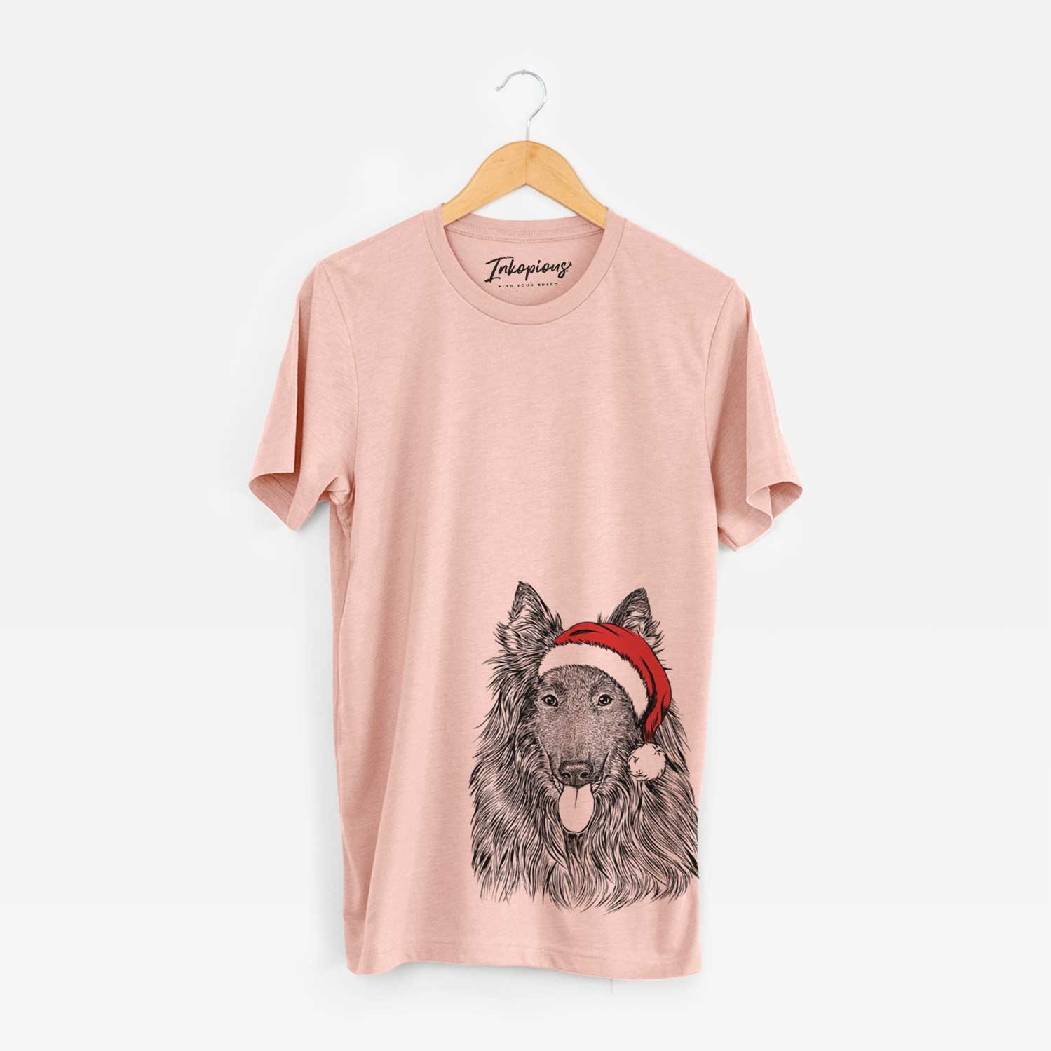 Hand-drawn sketch of Daan the Belgian Shepherd wearing a Santa hat on a Peach Unisex crewneck