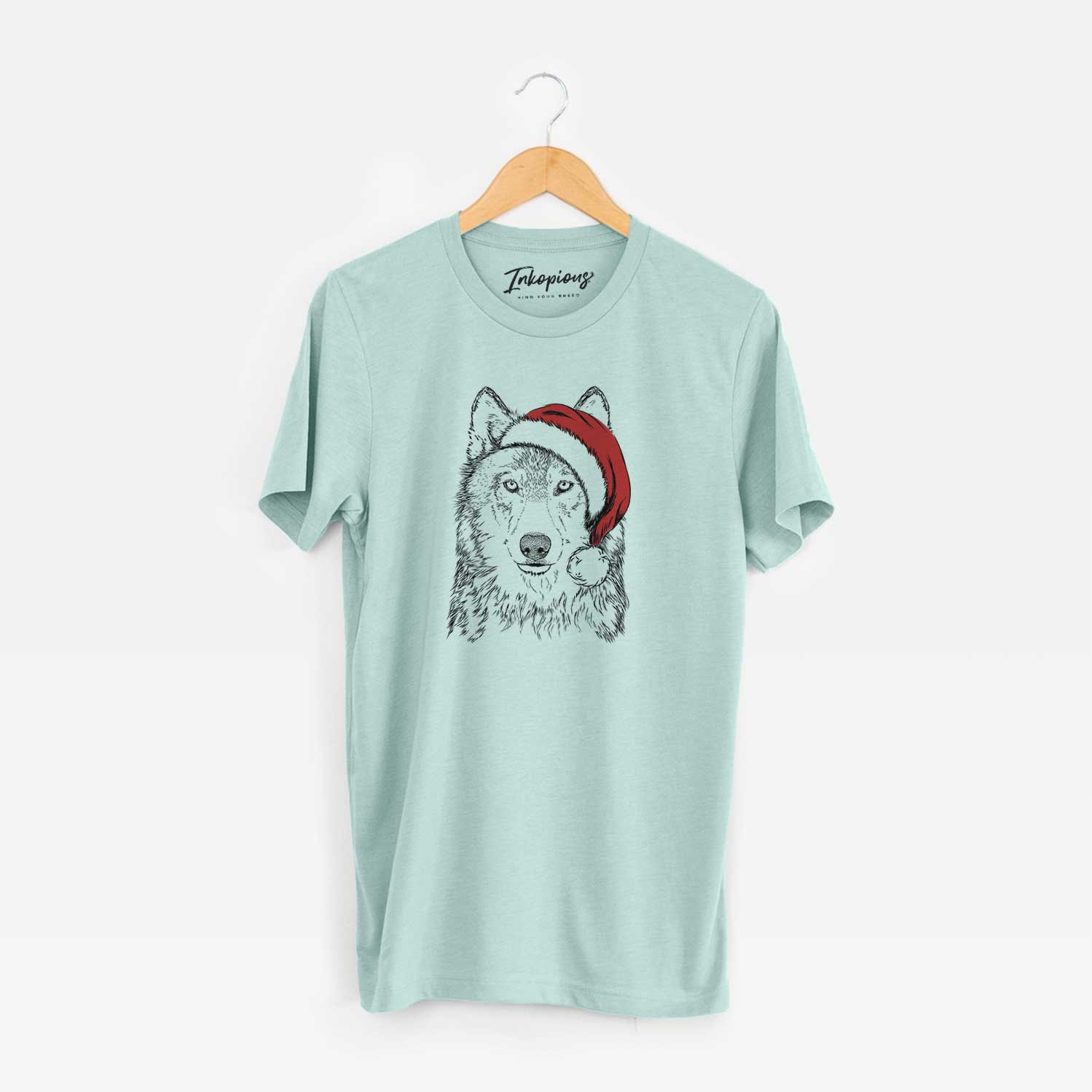 Hand-drawn sketch of Django the Grey Wolf wearing a Santa hat on a Heather Sage Unisex crewneck