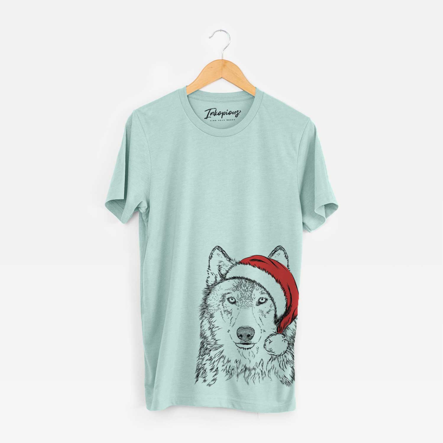 Hand-drawn sketch of Django the Grey Wolf wearing a Santa hat on a Heather Sage Unisex crewneck