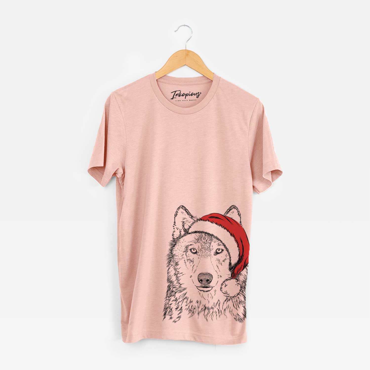 Hand-drawn sketch of Django the Grey Wolf wearing a Santa hat on a Peach Unisex crewneck