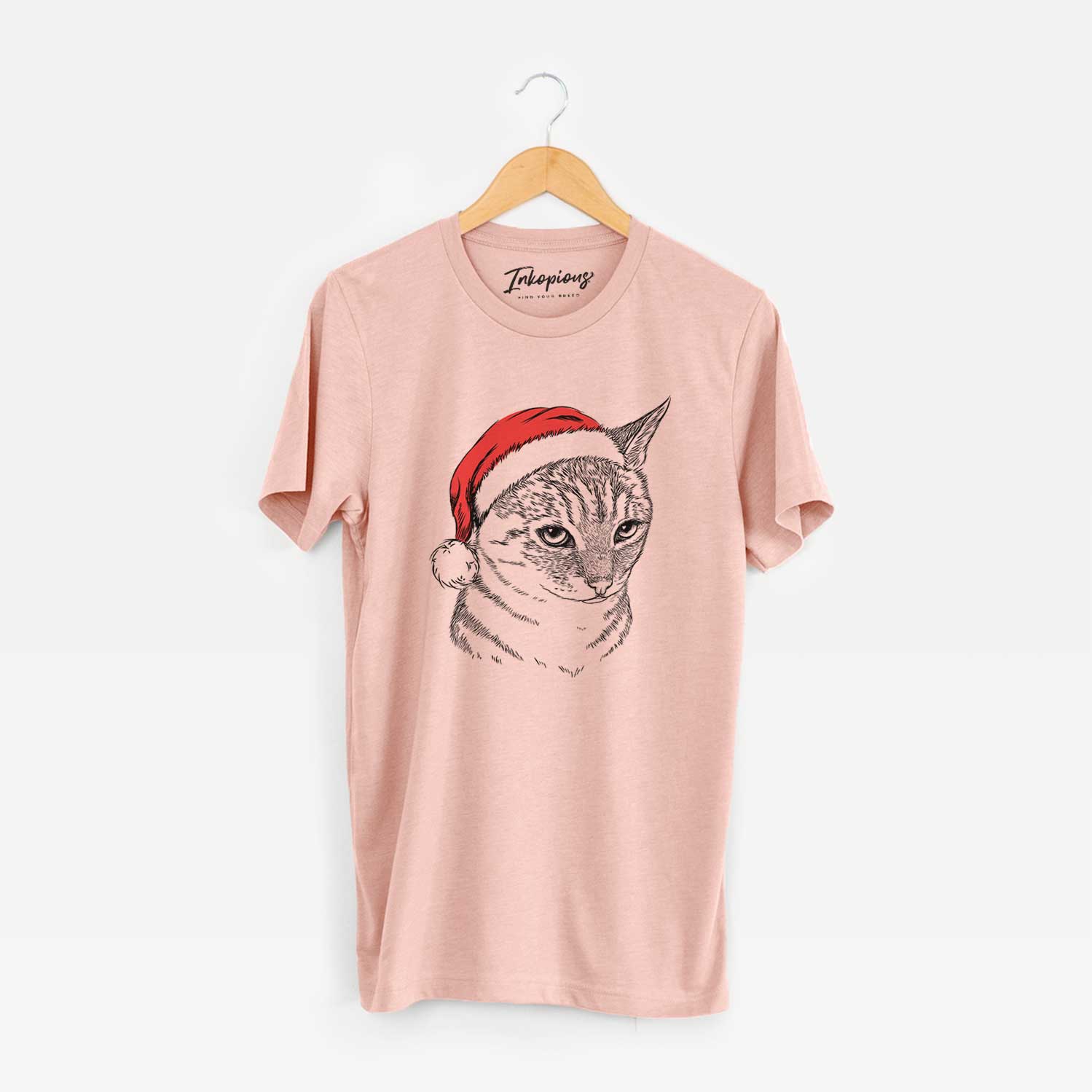 Hand-drawn sketch of Dora the Tabby Cat wearing a Santa hat on a Peach Unisex crewneck