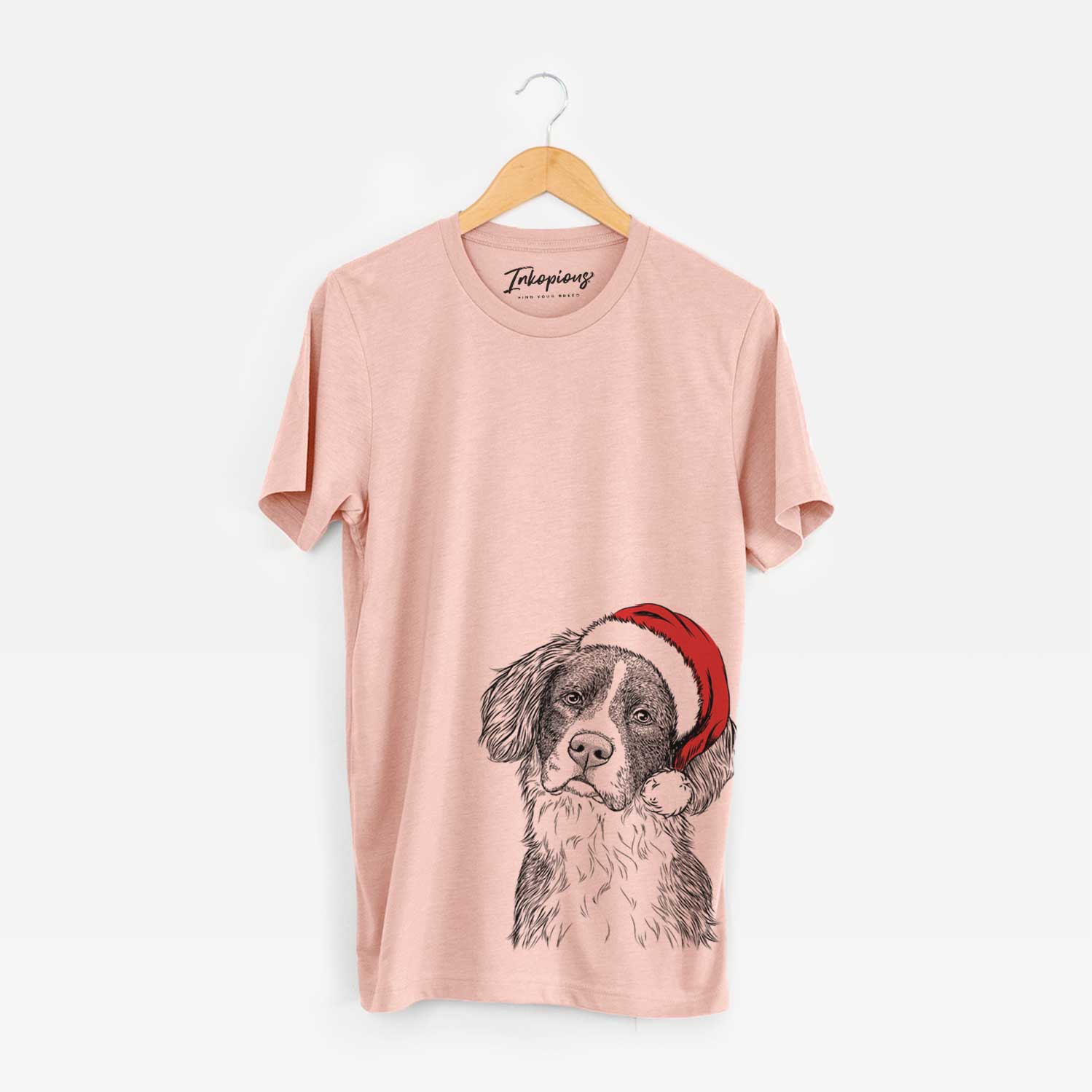 Hand-drawn sketch of Dulce the Drentsche Patrijshond wearing a Santa hat on a Peach Unisex crewneck