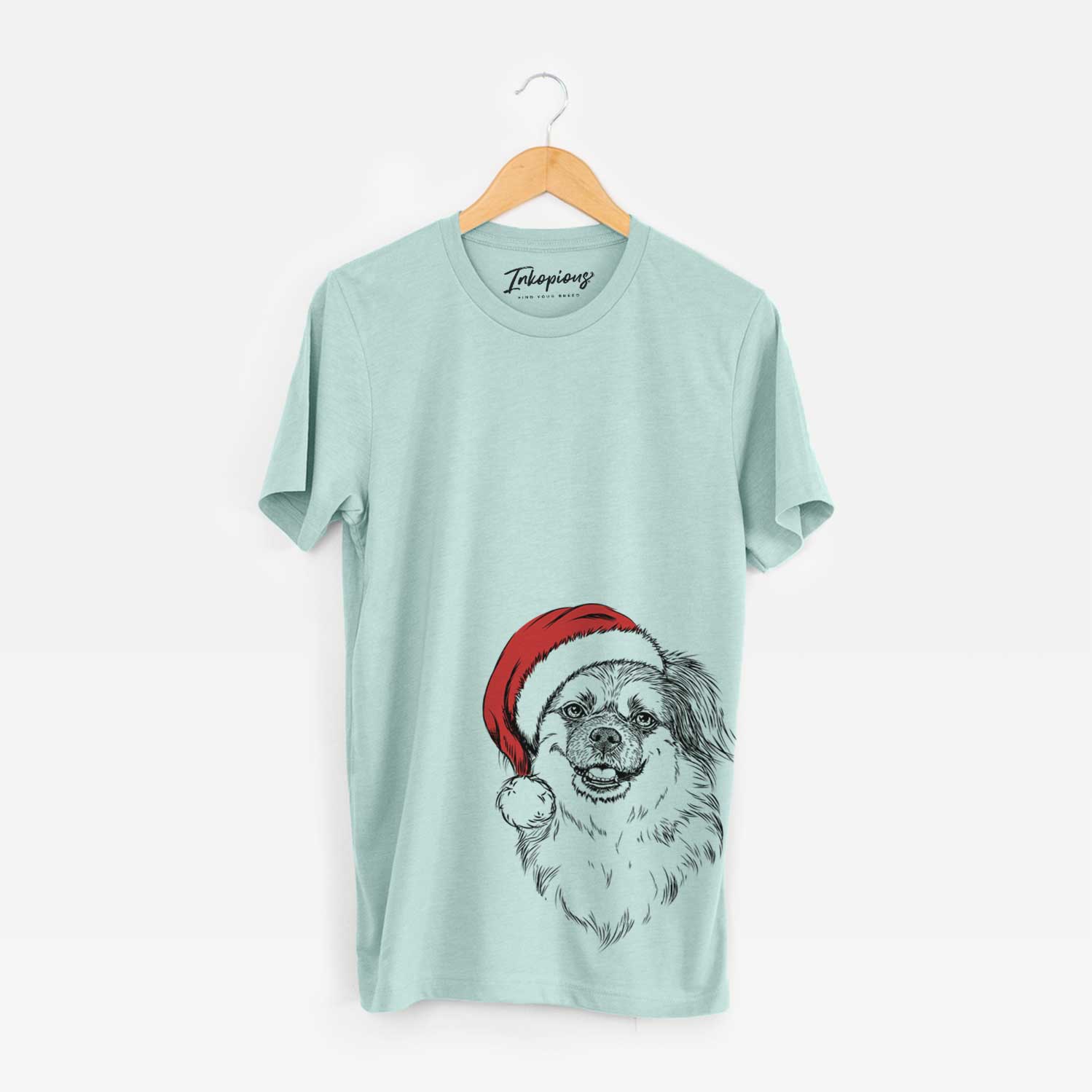 Hand-drawn sketch of Ed the Tibetan Spaniel wearing a Santa hat on a Heather Sage Unisex crewneck