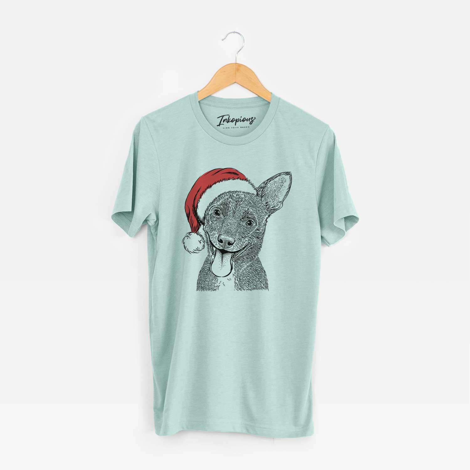 Hand-drawn sketch of Elvira the Terrier Mix wearing a Santa hat on a Heather Sage Unisex crewneck