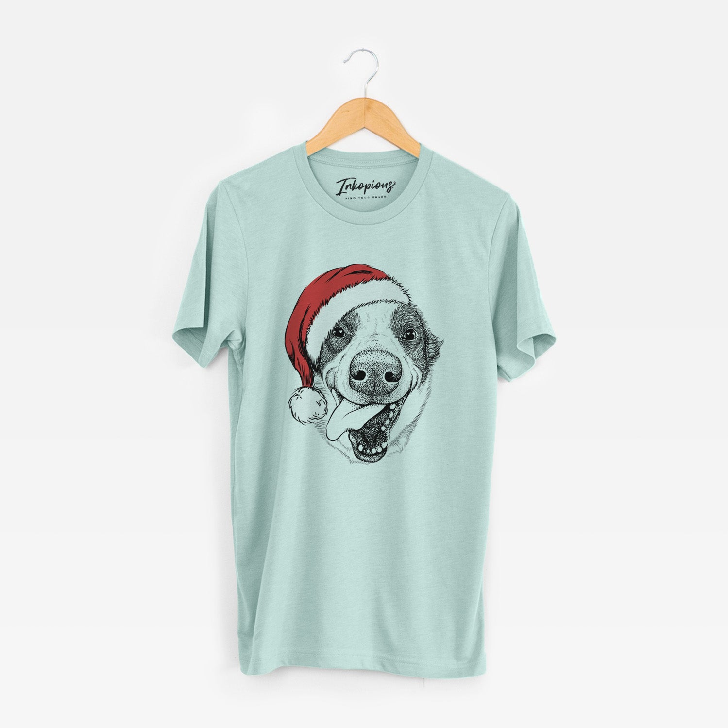 Hand-drawn sketch of Elwood the Border Collie wearing a Santa hat on a Heather Sage Unisex crewneck