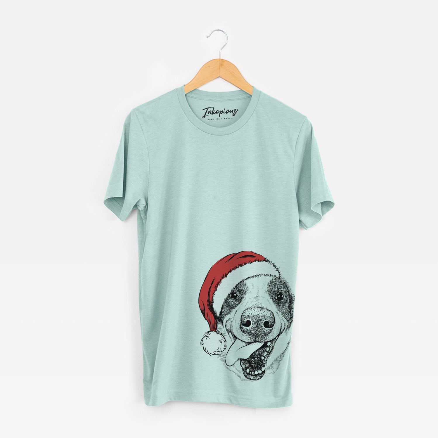 Hand-drawn sketch of Elwood the Border Collie wearing a Santa hat on a Heather Sage Unisex crewneck