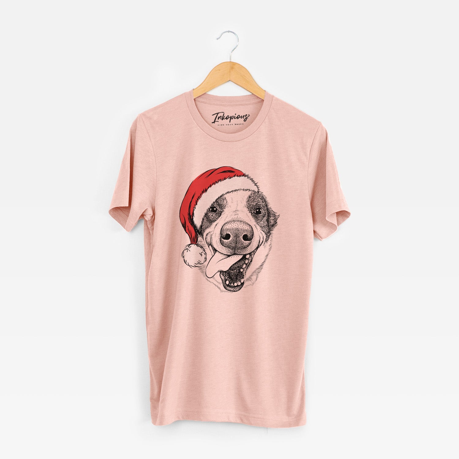 Hand-drawn sketch of Elwood the Border Collie wearing a Santa hat on a Peach Unisex crewneck