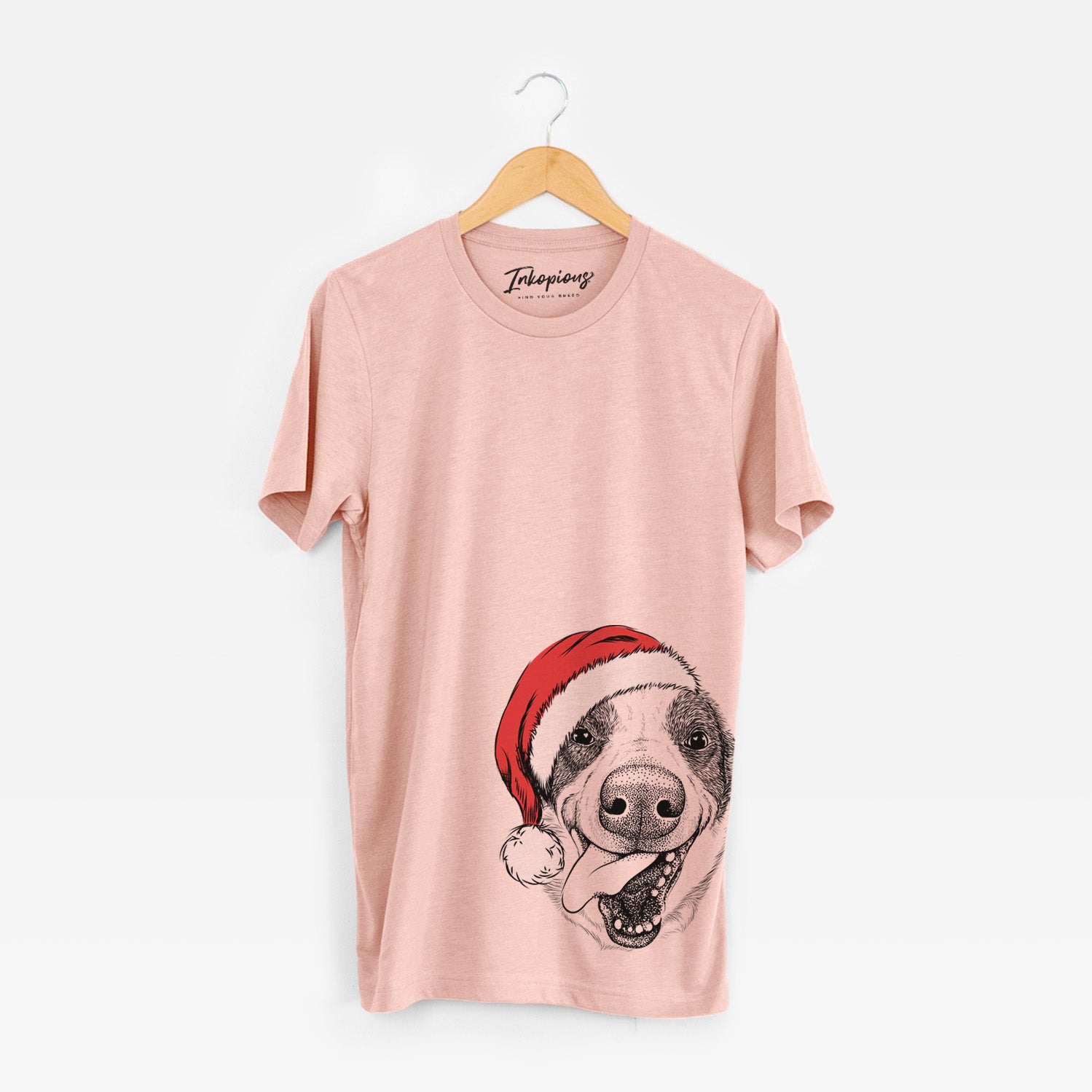 Hand-drawn sketch of Elwood the Border Collie wearing a Santa hat on a Peach Unisex crewneck